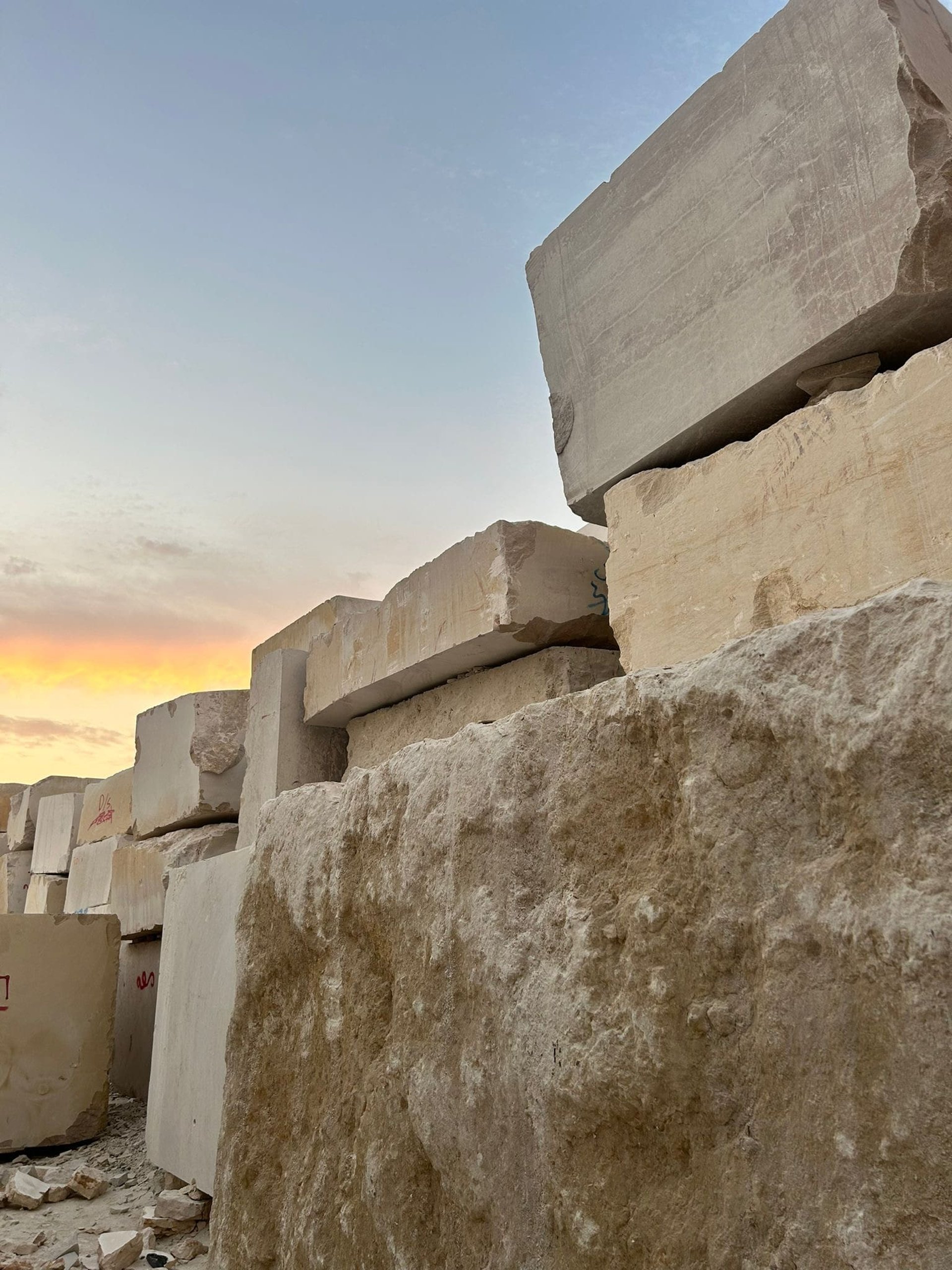 an abstract painting of blue, brown, and white colors