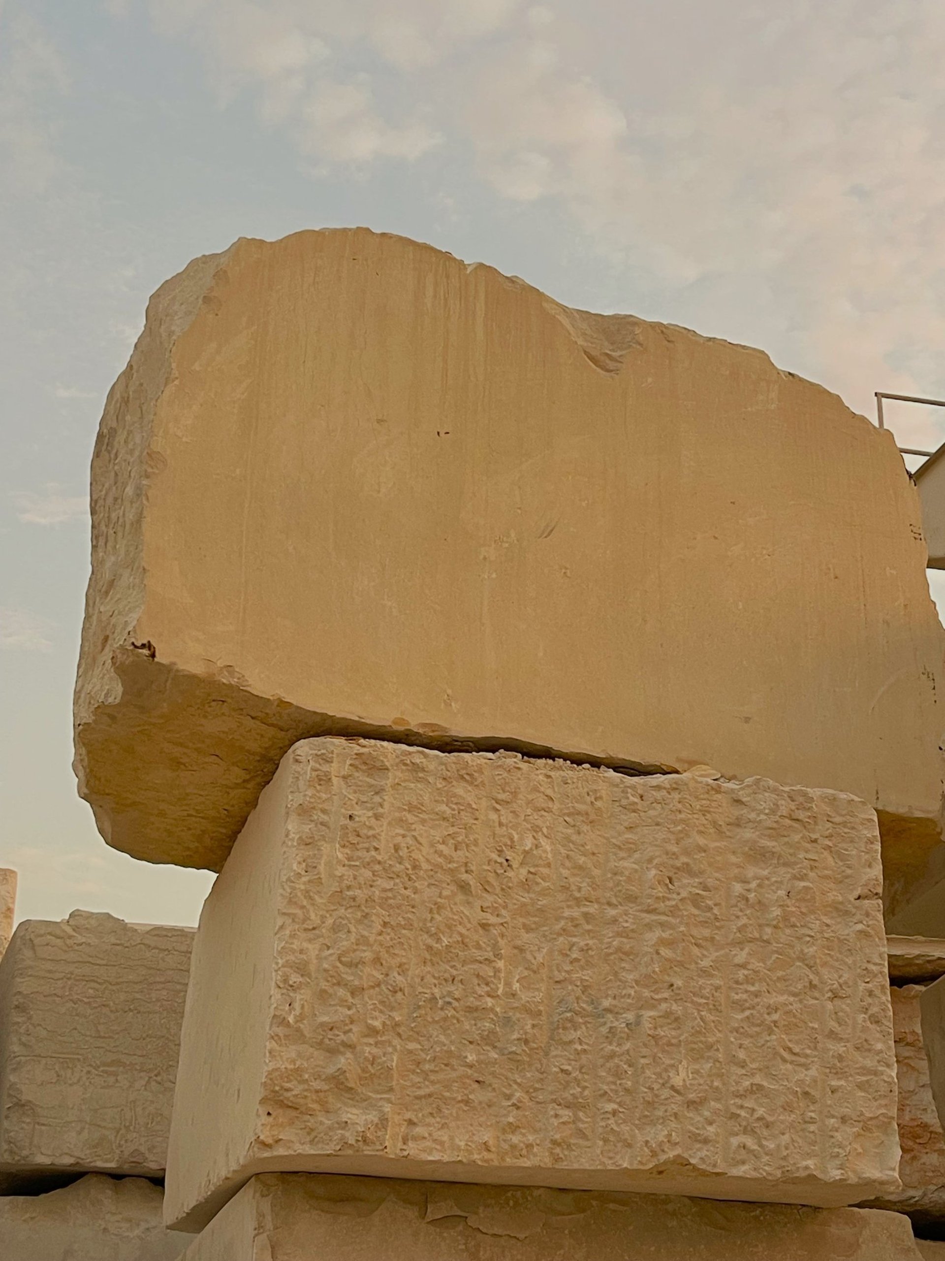 an abstract painting of blue, brown, and white colors