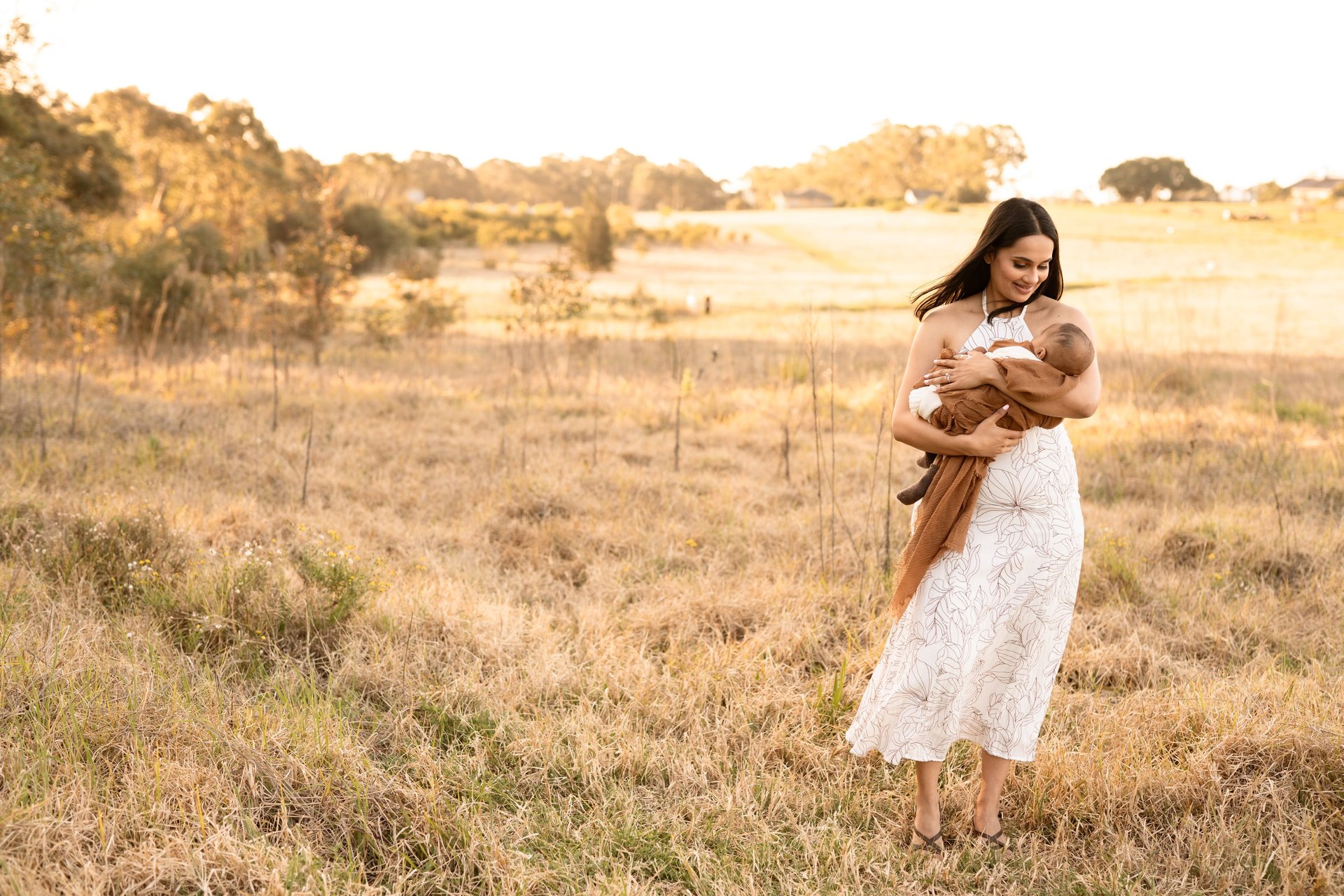 an abstract photo of a curved building with a blue sky in the background