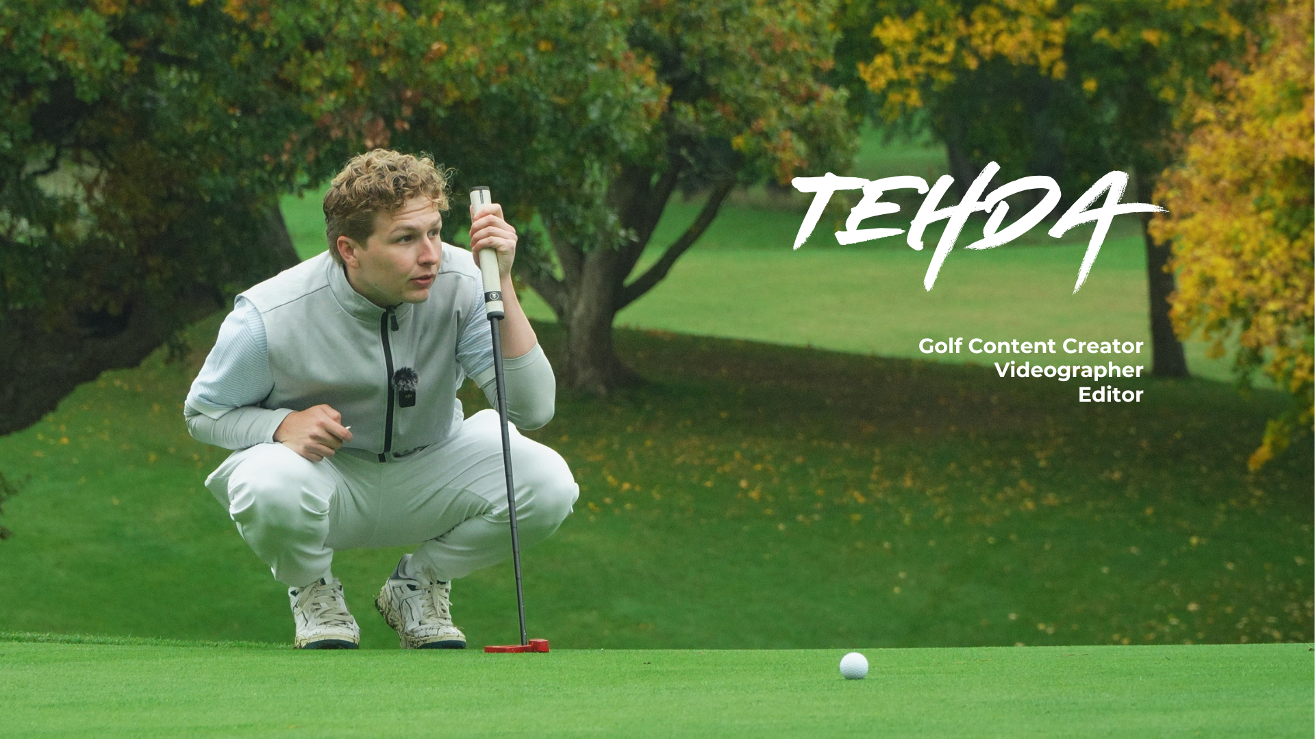 man holding black golf club