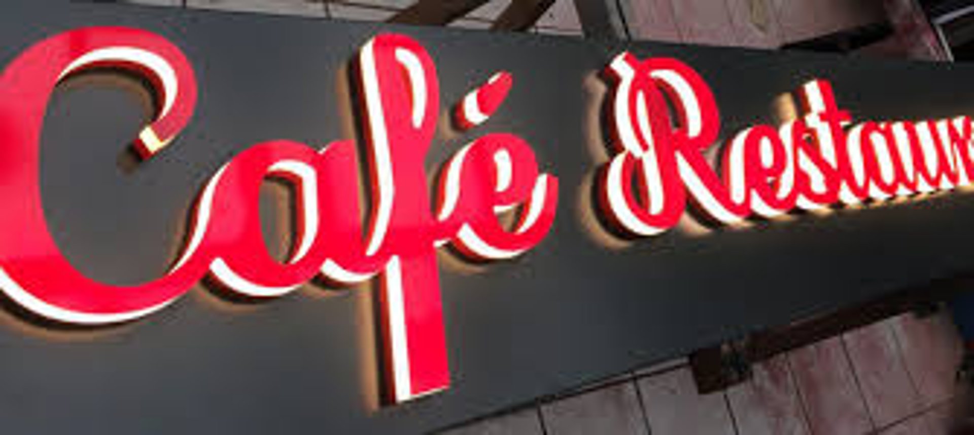 a hotel sign on top of a building