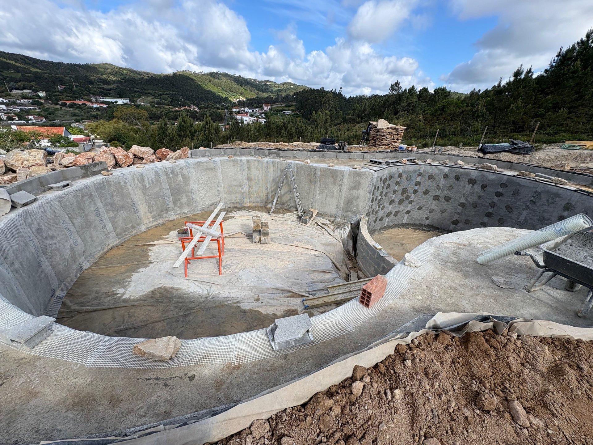 an abstract photo of a curved building with a blue sky in the background