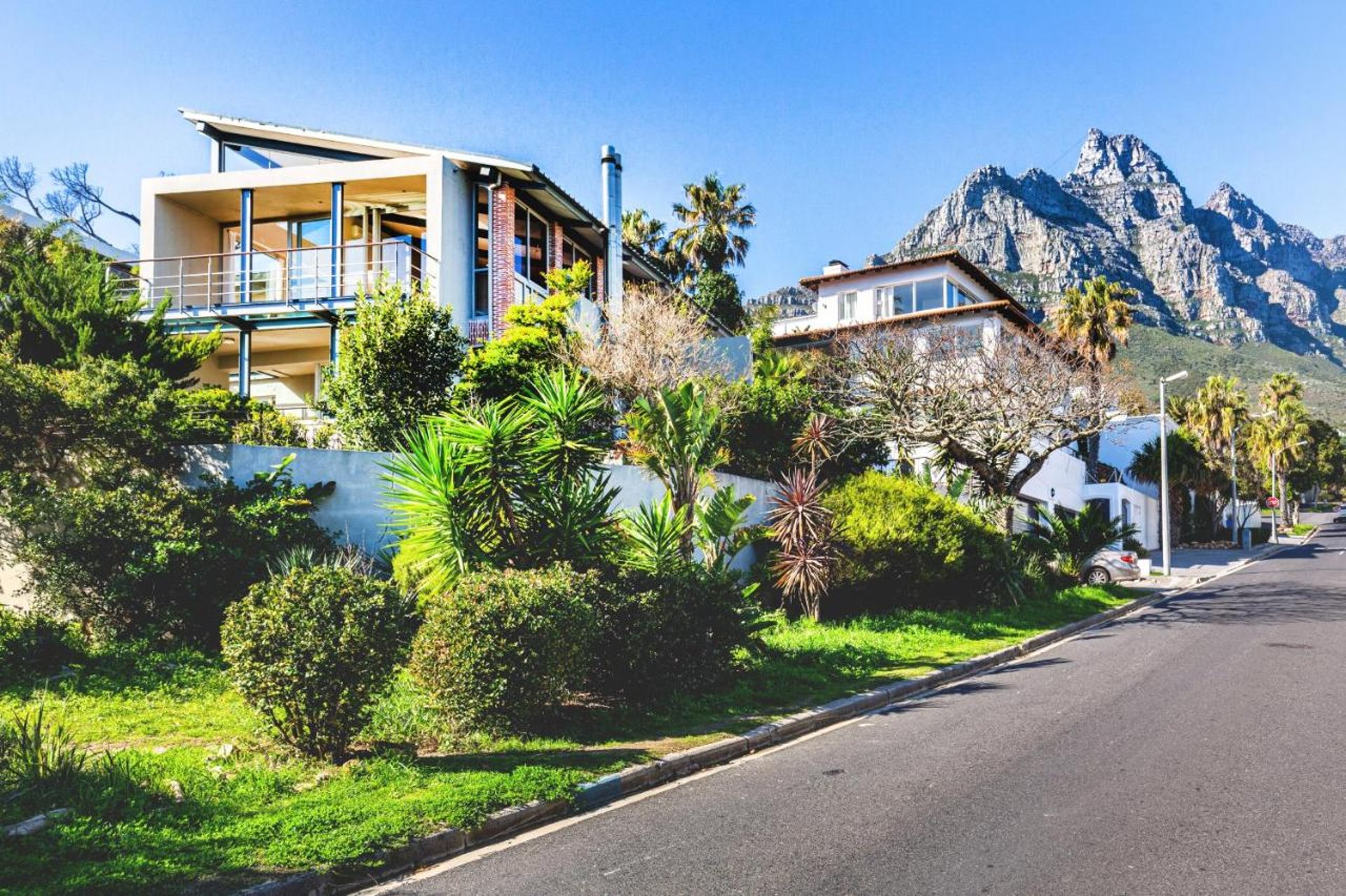 woman wearing yellow long-sleeved dress under white clouds and blue sky during daytime