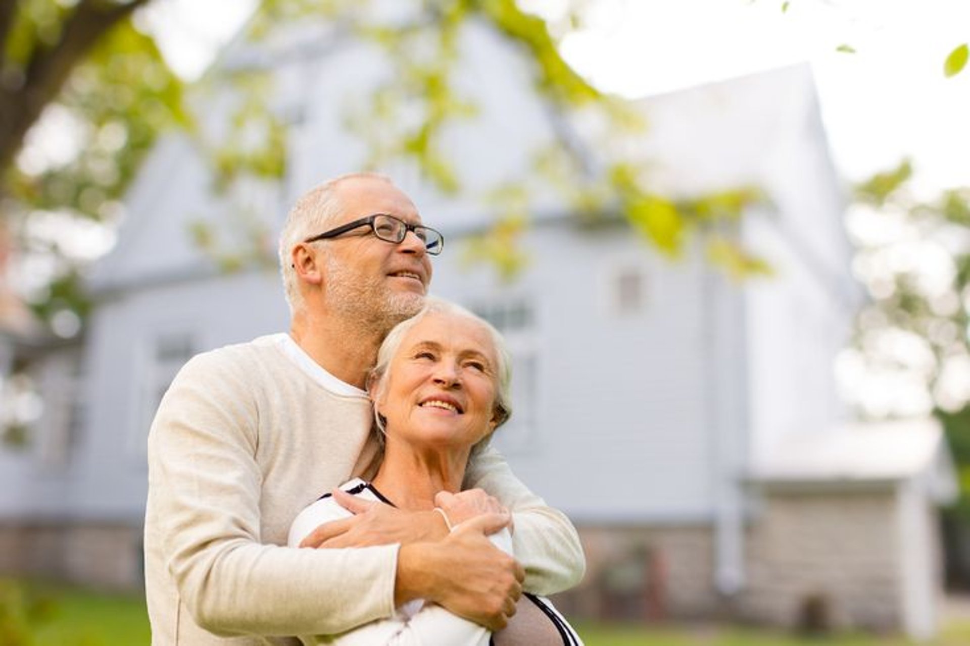 man in white dress shirt carrying girl in black dress