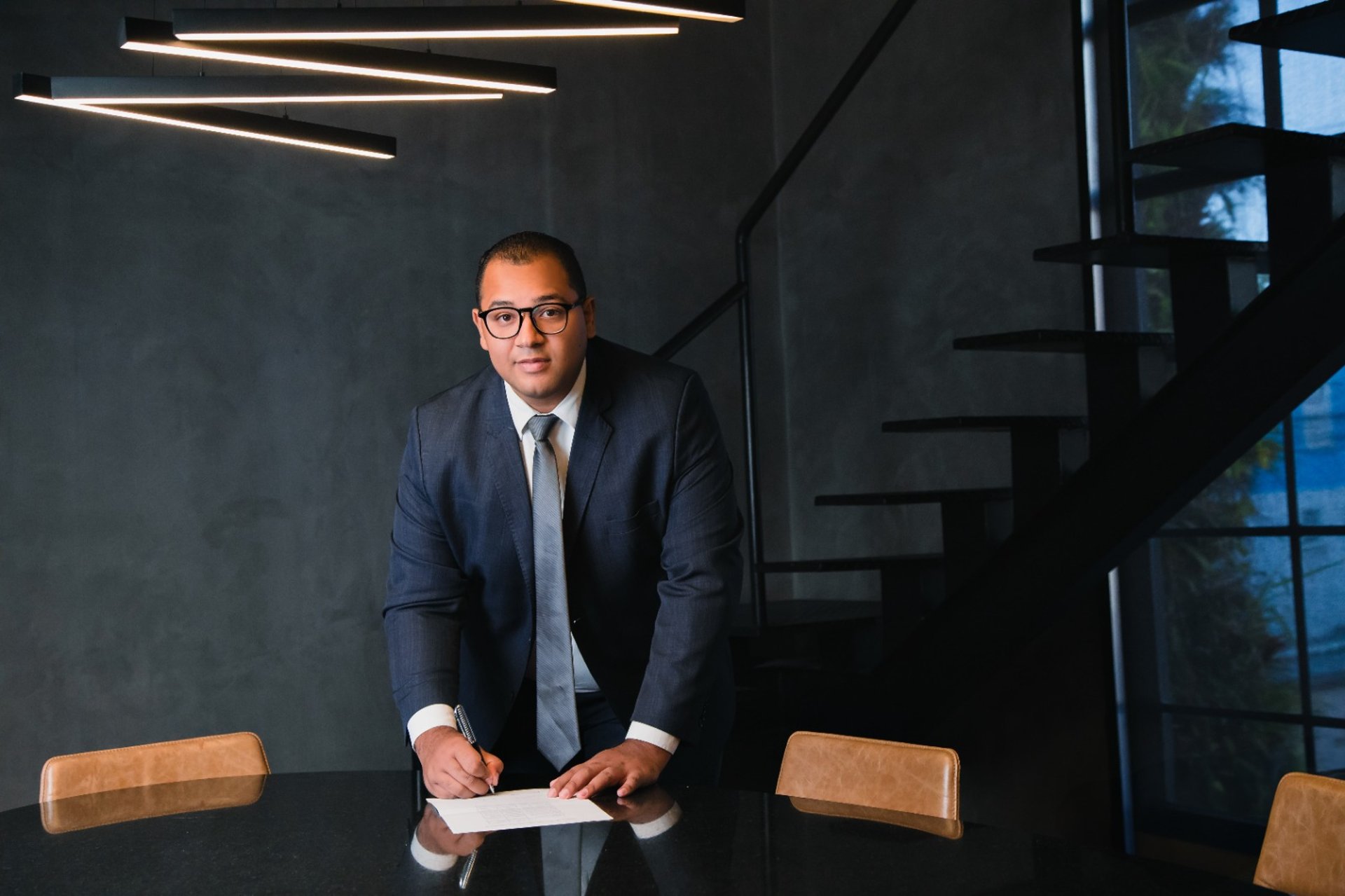 an abstract photo of a curved building with a blue sky in the background