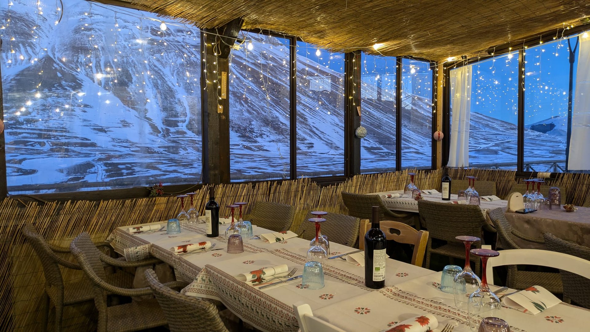 brown concrete building near green trees under blue sky during daytime