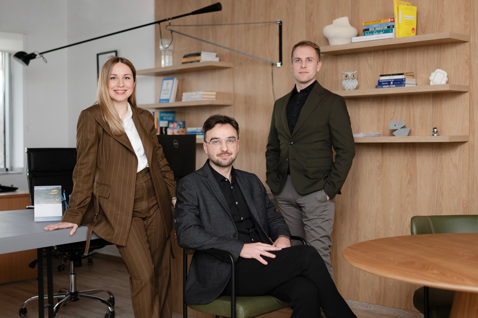 woman using black VR headset beside computer