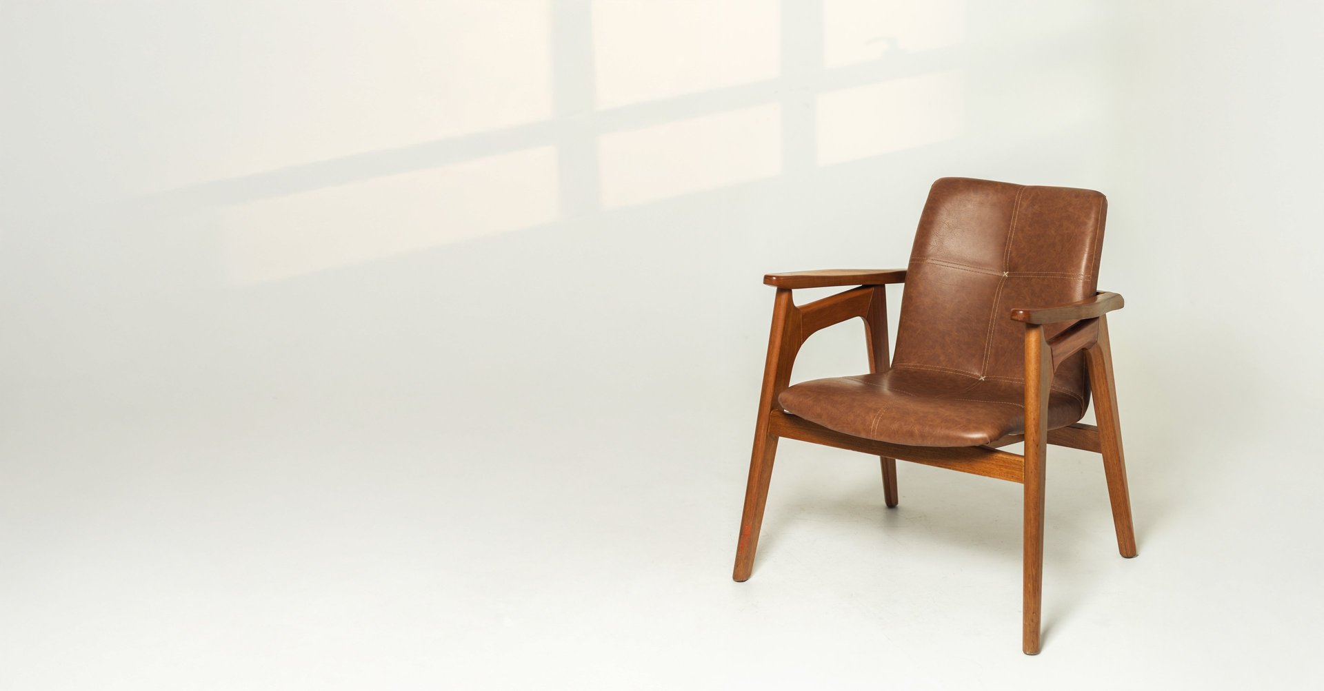 an abstract photo of a curved building with a blue sky in the background