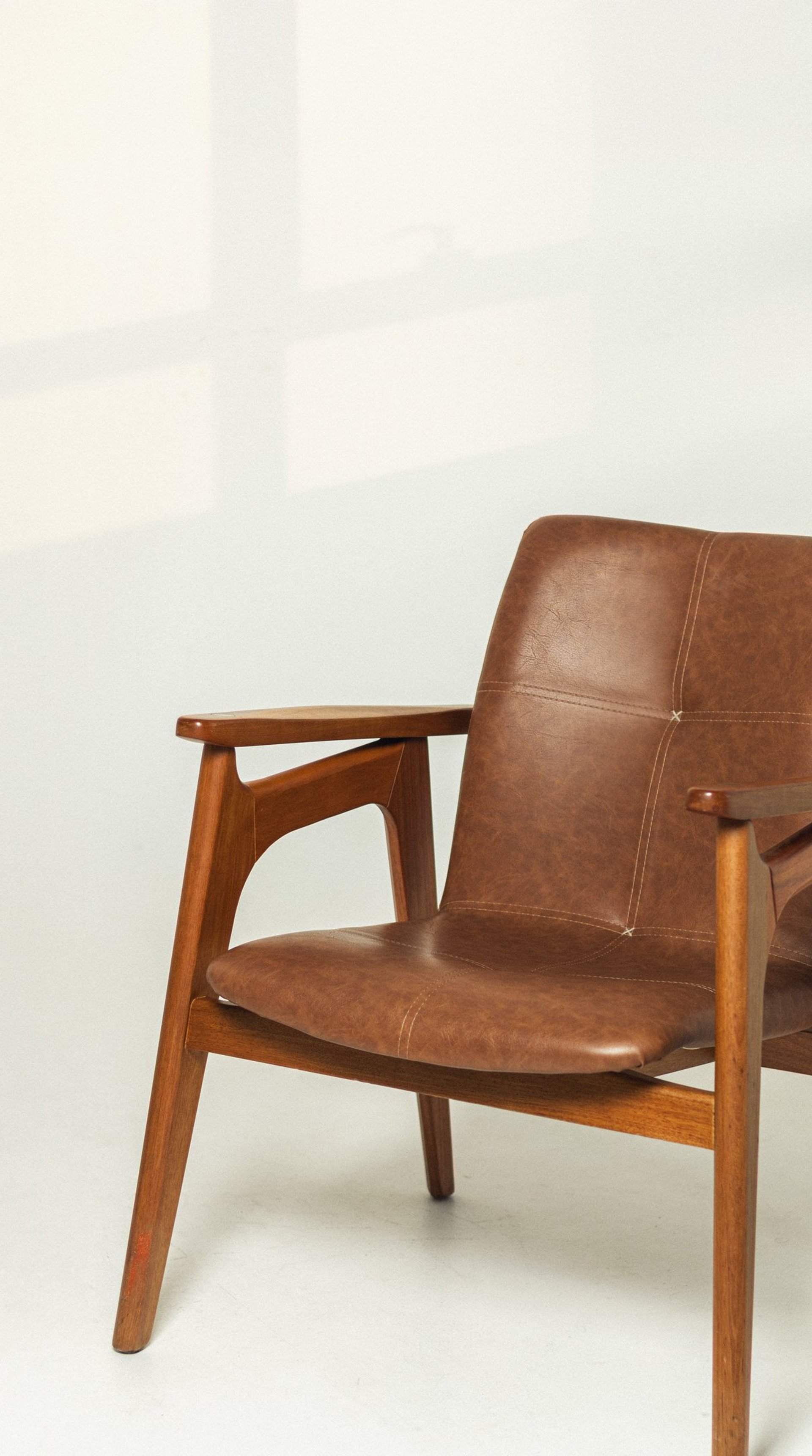 an abstract photo of a curved building with a blue sky in the background