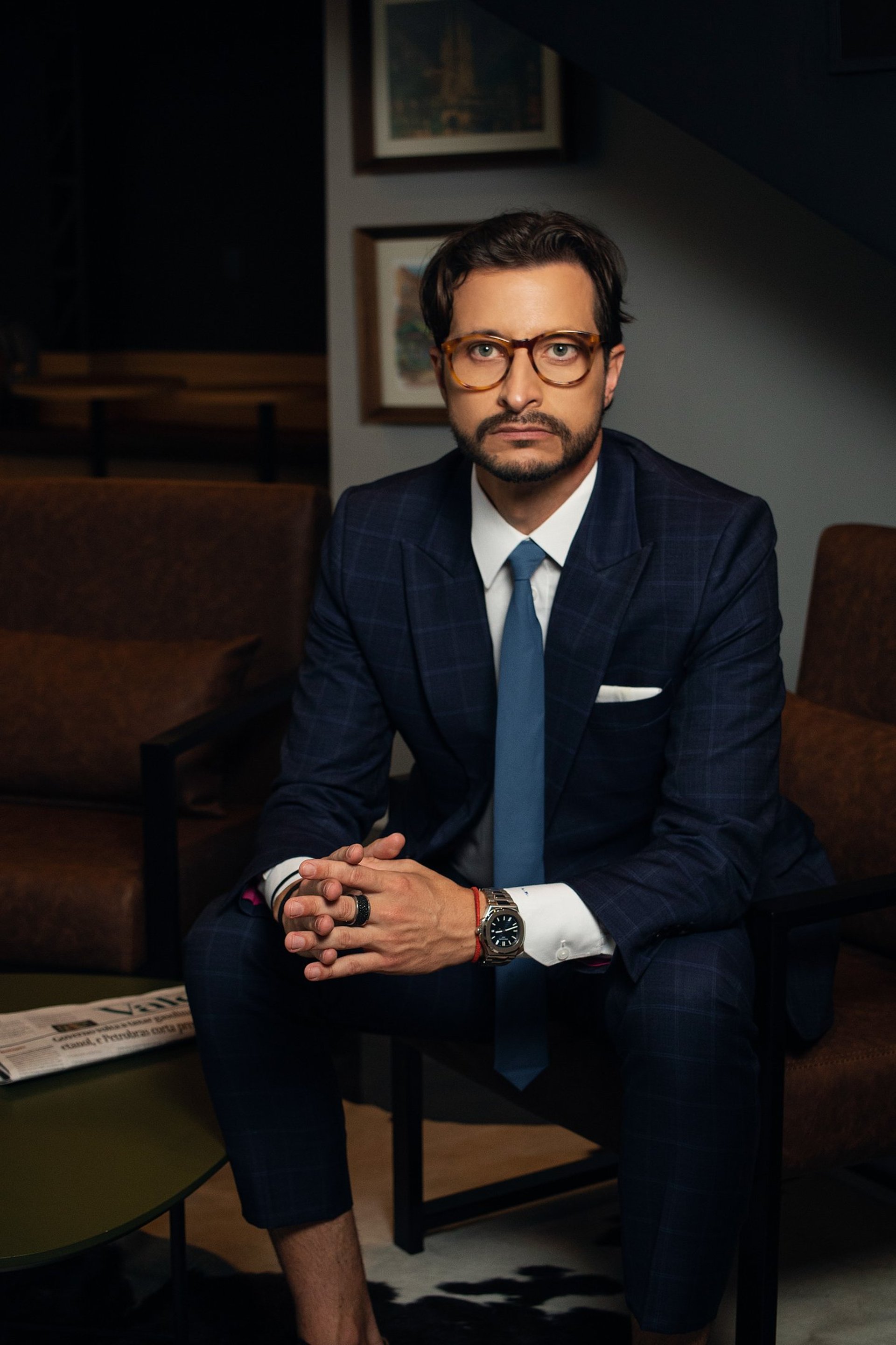 an abstract photo of a curved building with a blue sky in the background