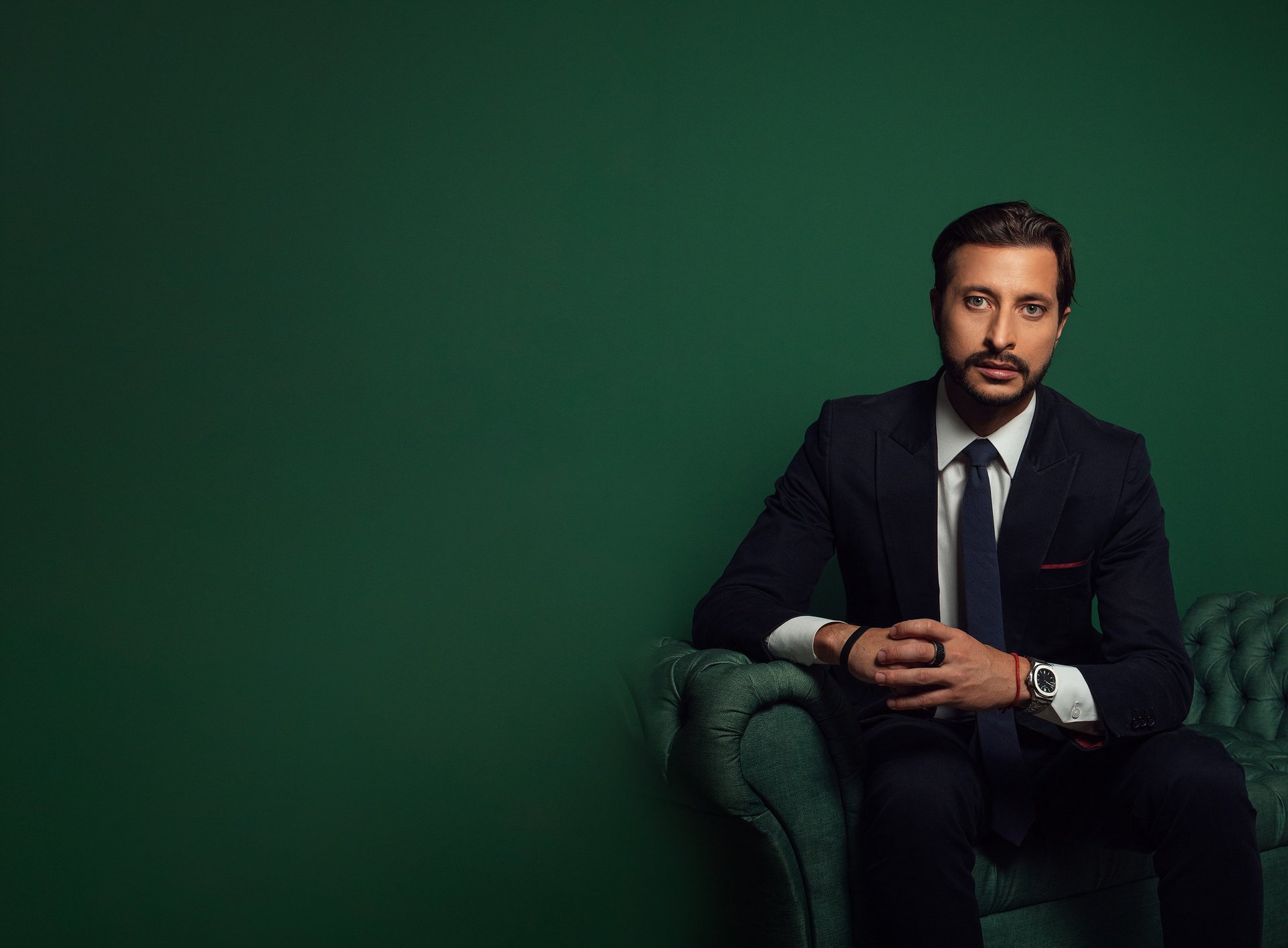 an abstract photo of a curved building with a blue sky in the background