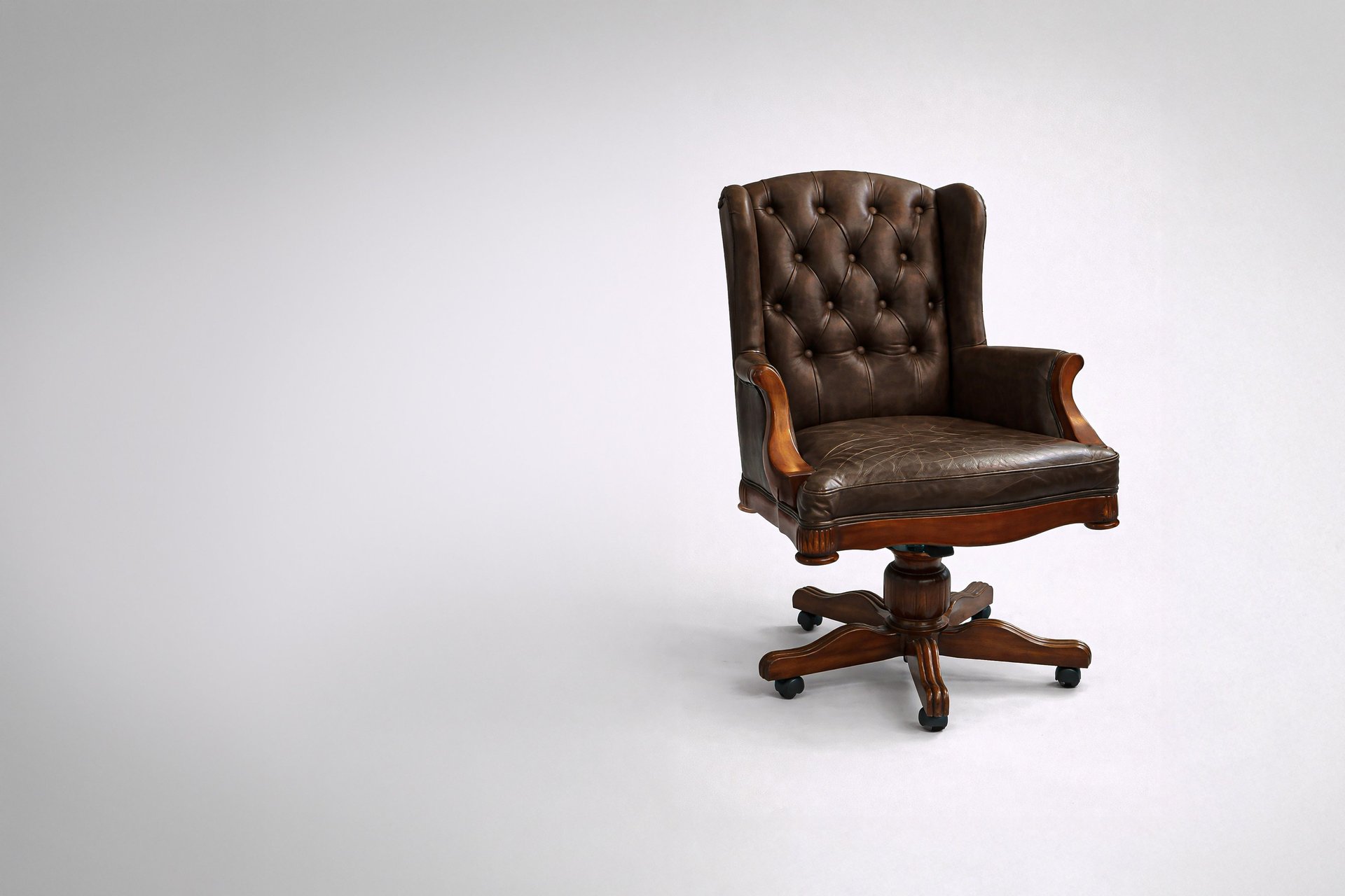 an abstract photo of a curved building with a blue sky in the background