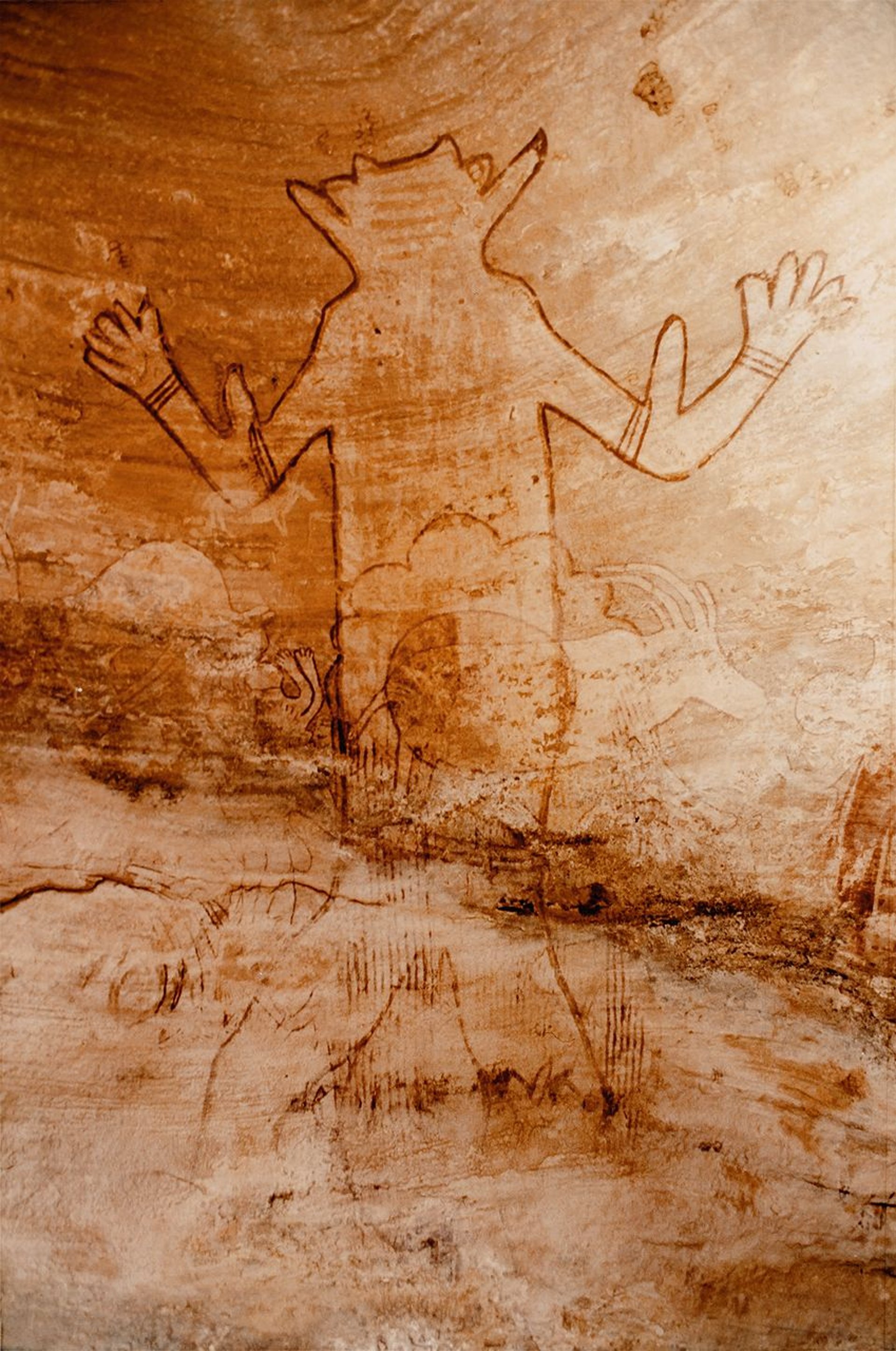 a large rock with some animals on it
