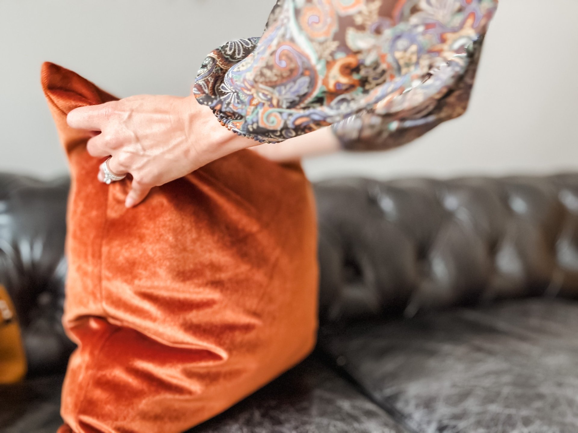 a living room filled with furniture and a large window