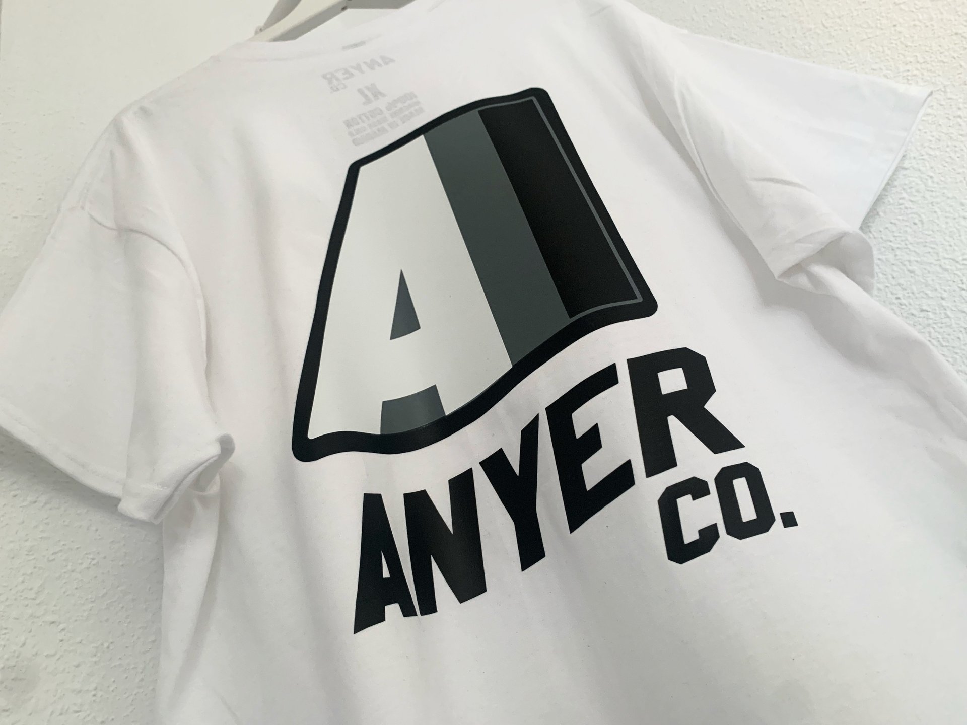 an abstract photo of a curved building with a blue sky in the background