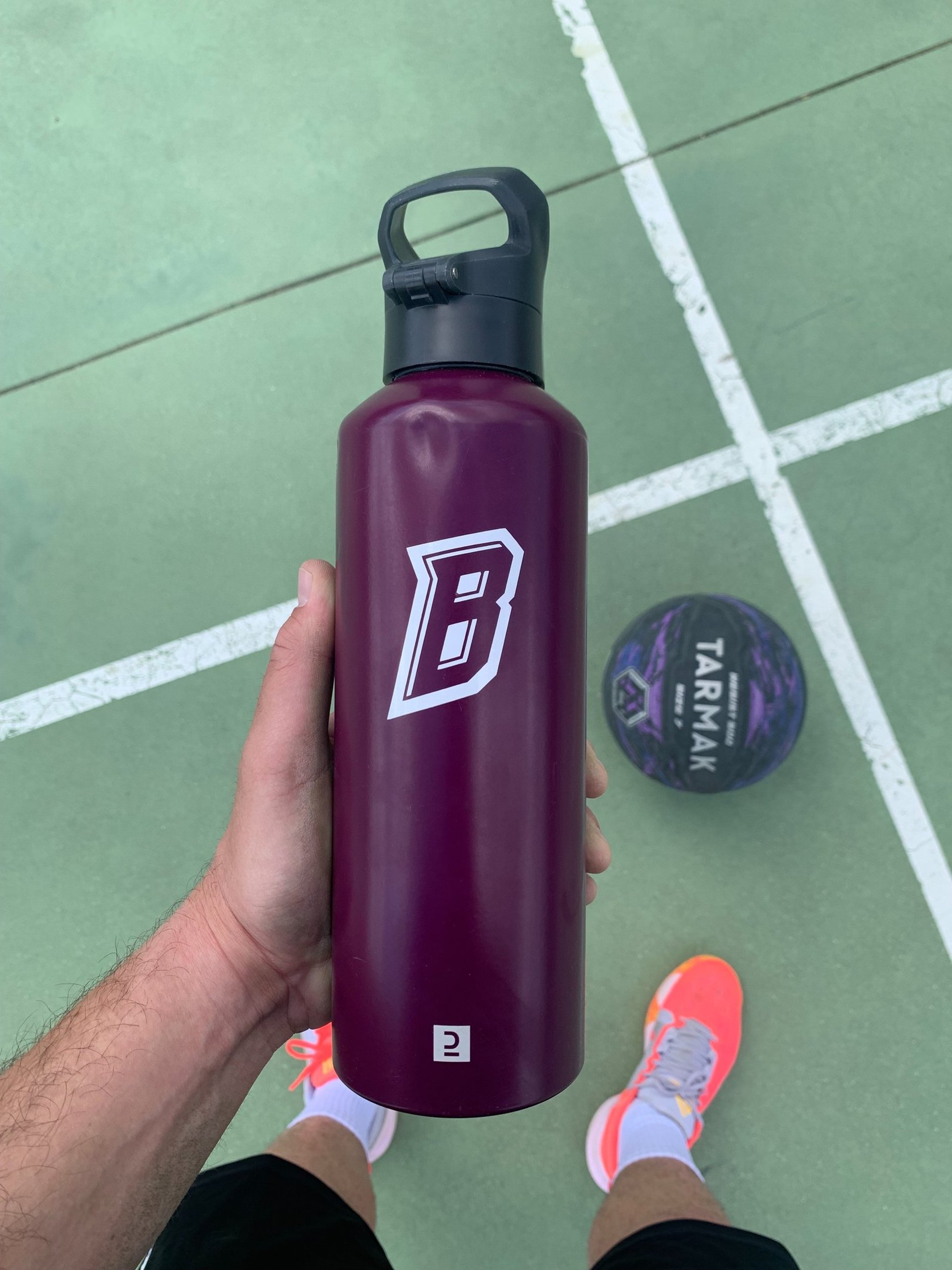 an abstract photo of a curved building with a blue sky in the background