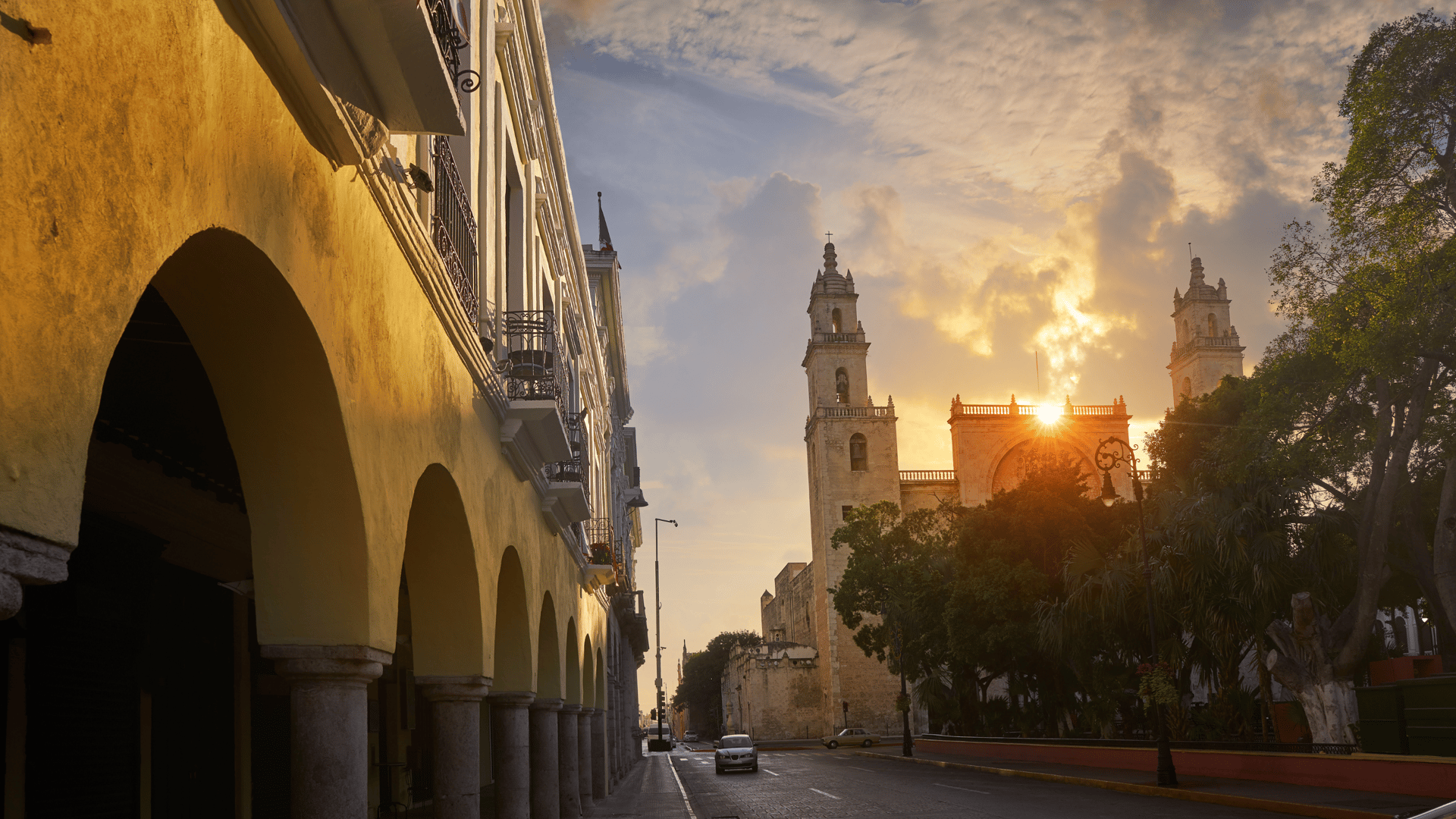 an abstract photo of a curved building with a blue sky in the background