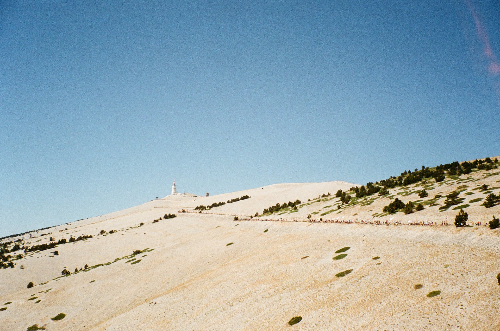 an abstract photo of a curved building with a blue sky in the background