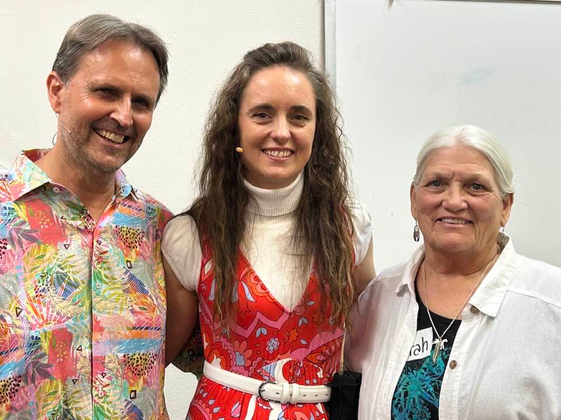 a person sitting at a table with a drawing of a woman