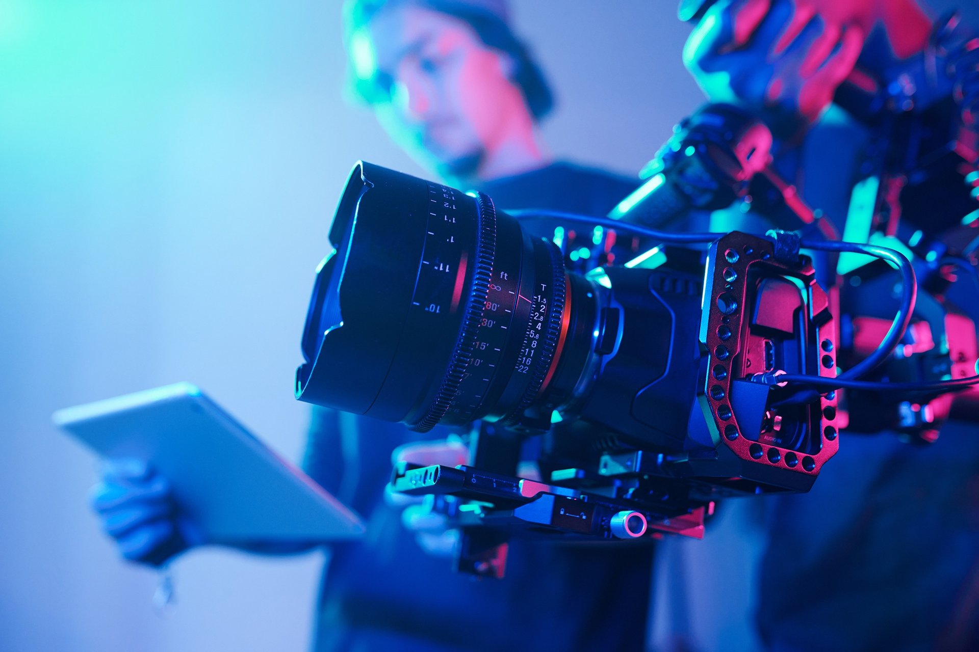 man in brown long sleeve shirt holding black dslr camera