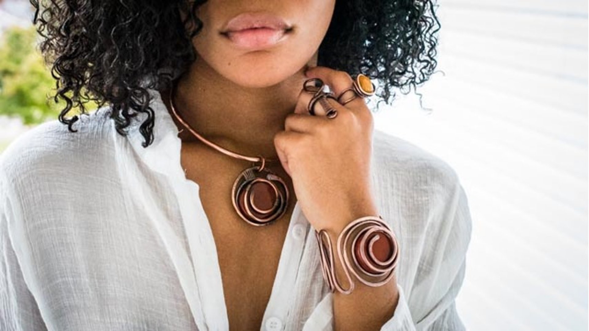 an abstract photo of a curved building with a blue sky in the background