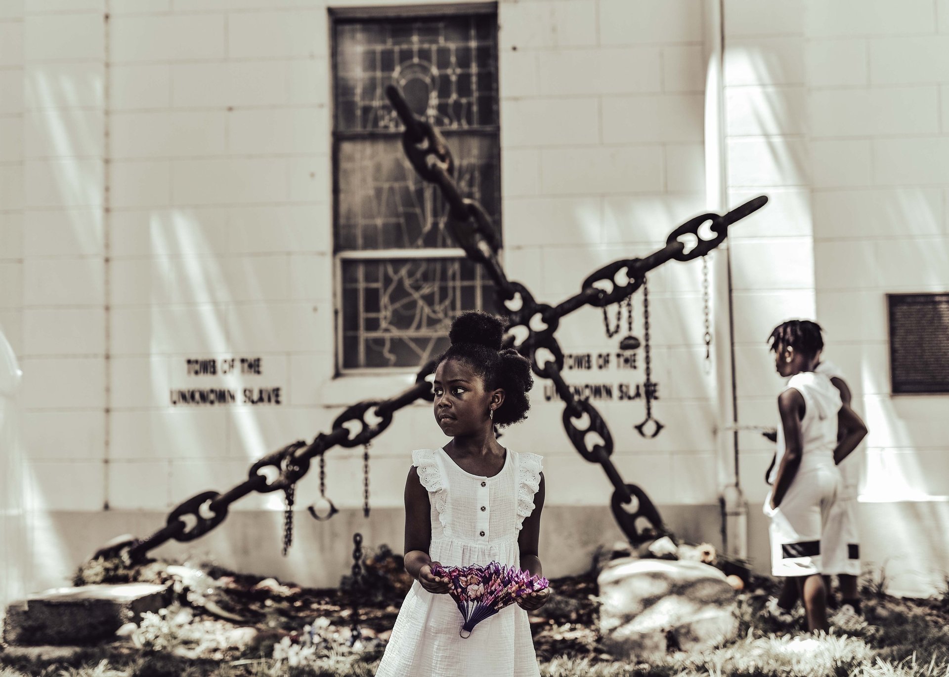 an abstract photo of a curved building with a blue sky in the background