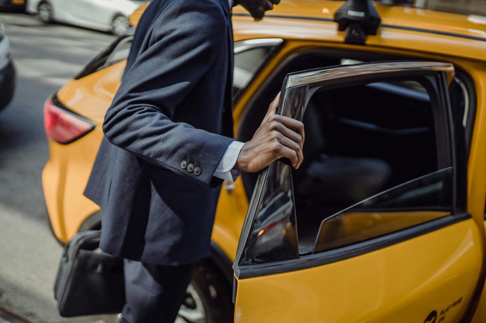 yellow cab in between of building