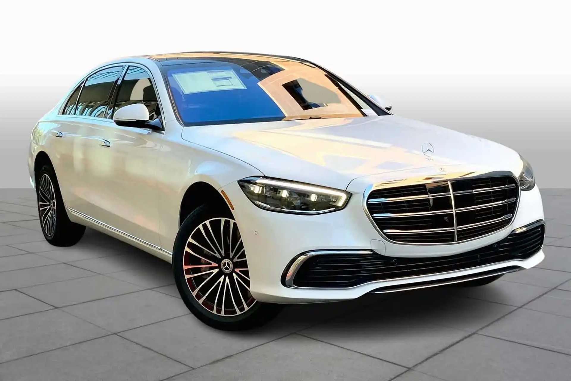 an abstract photo of a curved building with a blue sky in the background