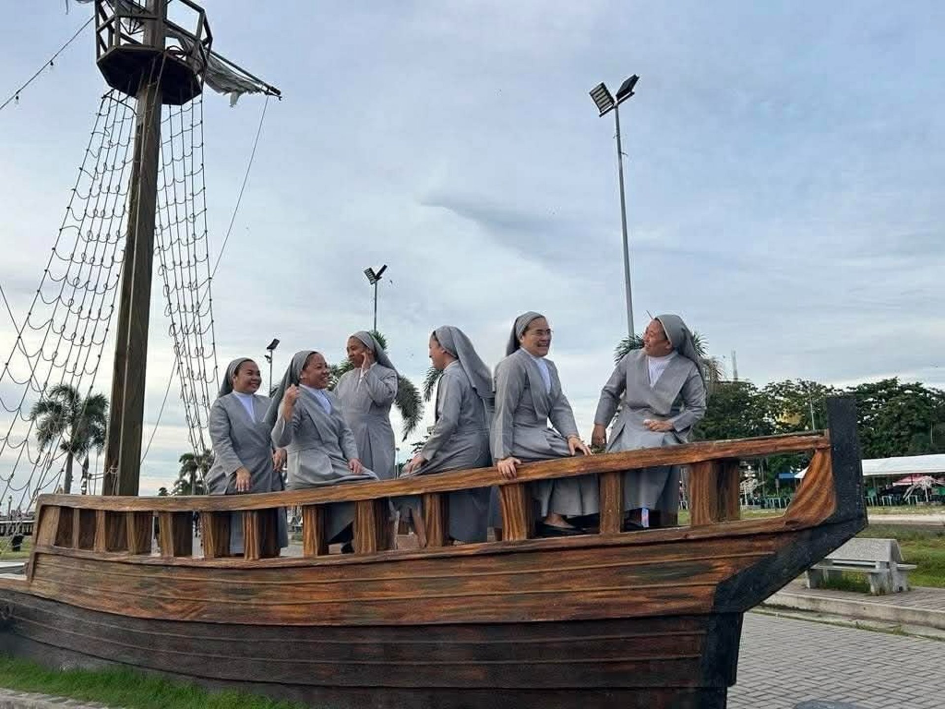 woman wearing yellow long-sleeved dress under white clouds and blue sky during daytime