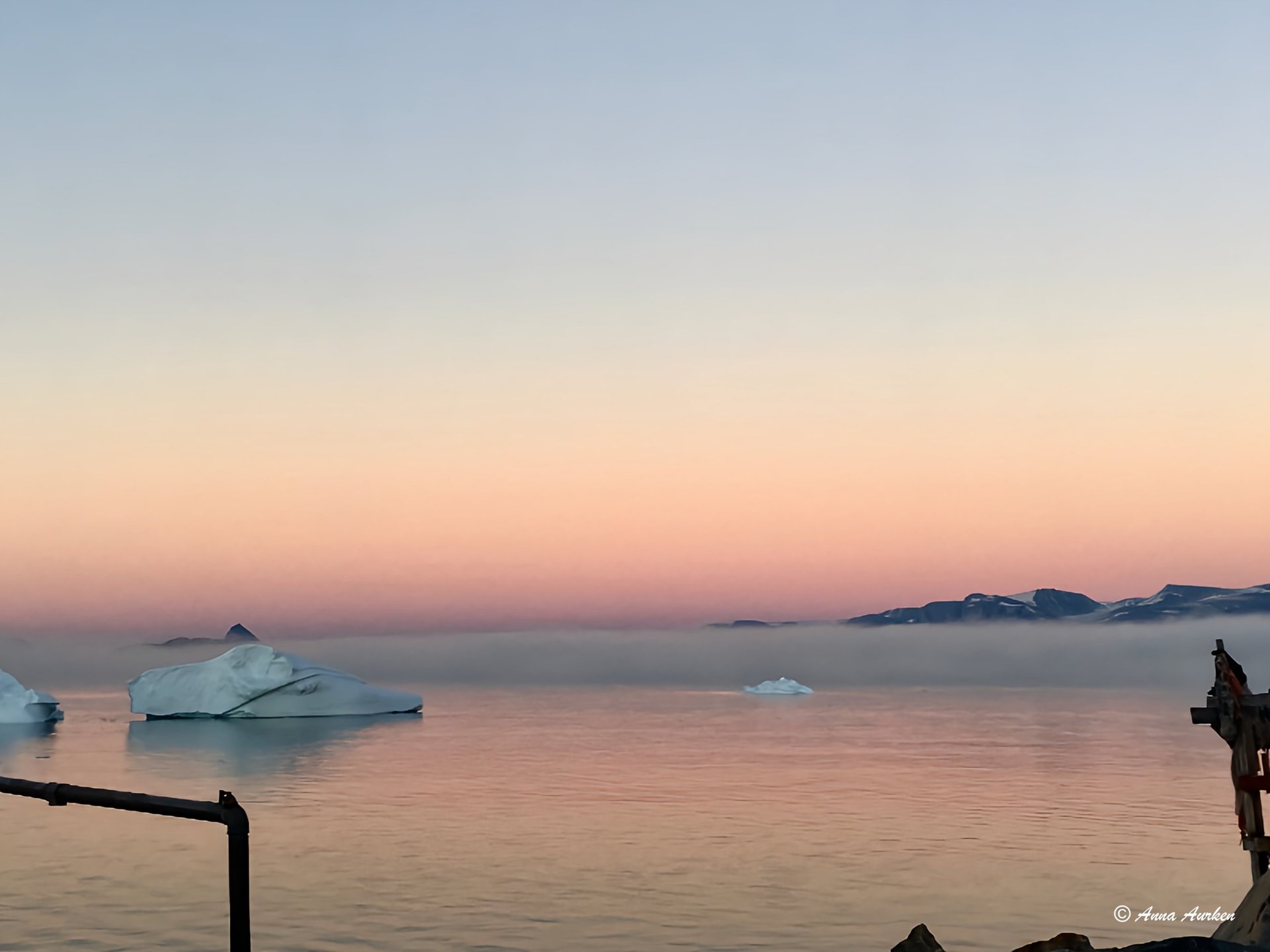 an abstract photo of a curved building with a blue sky in the background