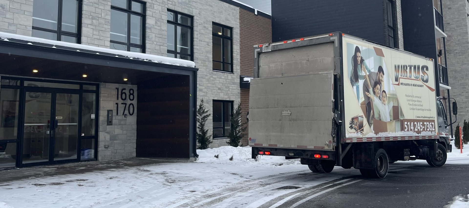 an abstract photo of a curved building with a blue sky in the background