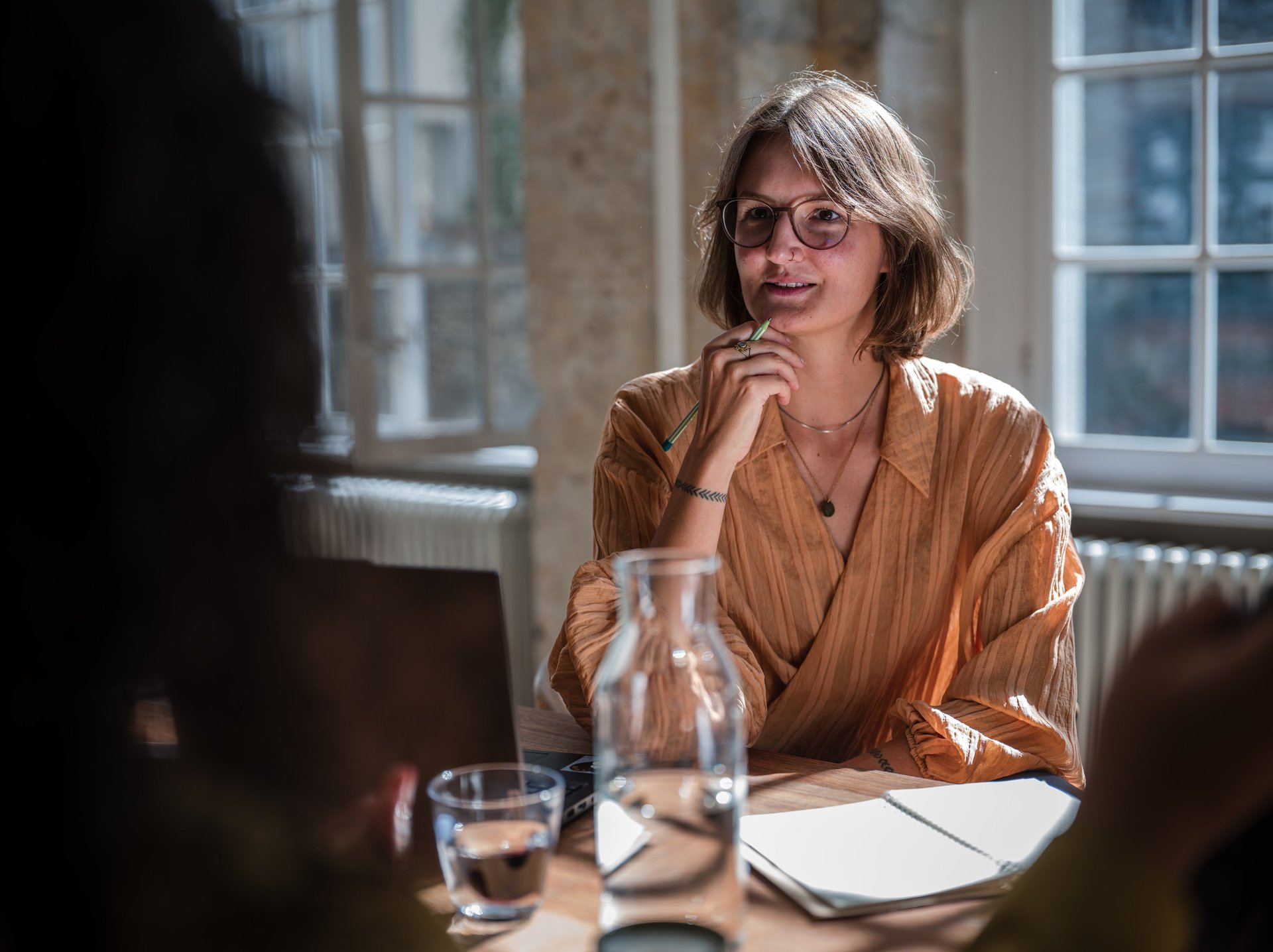 an abstract photo of a curved building with a blue sky in the background
