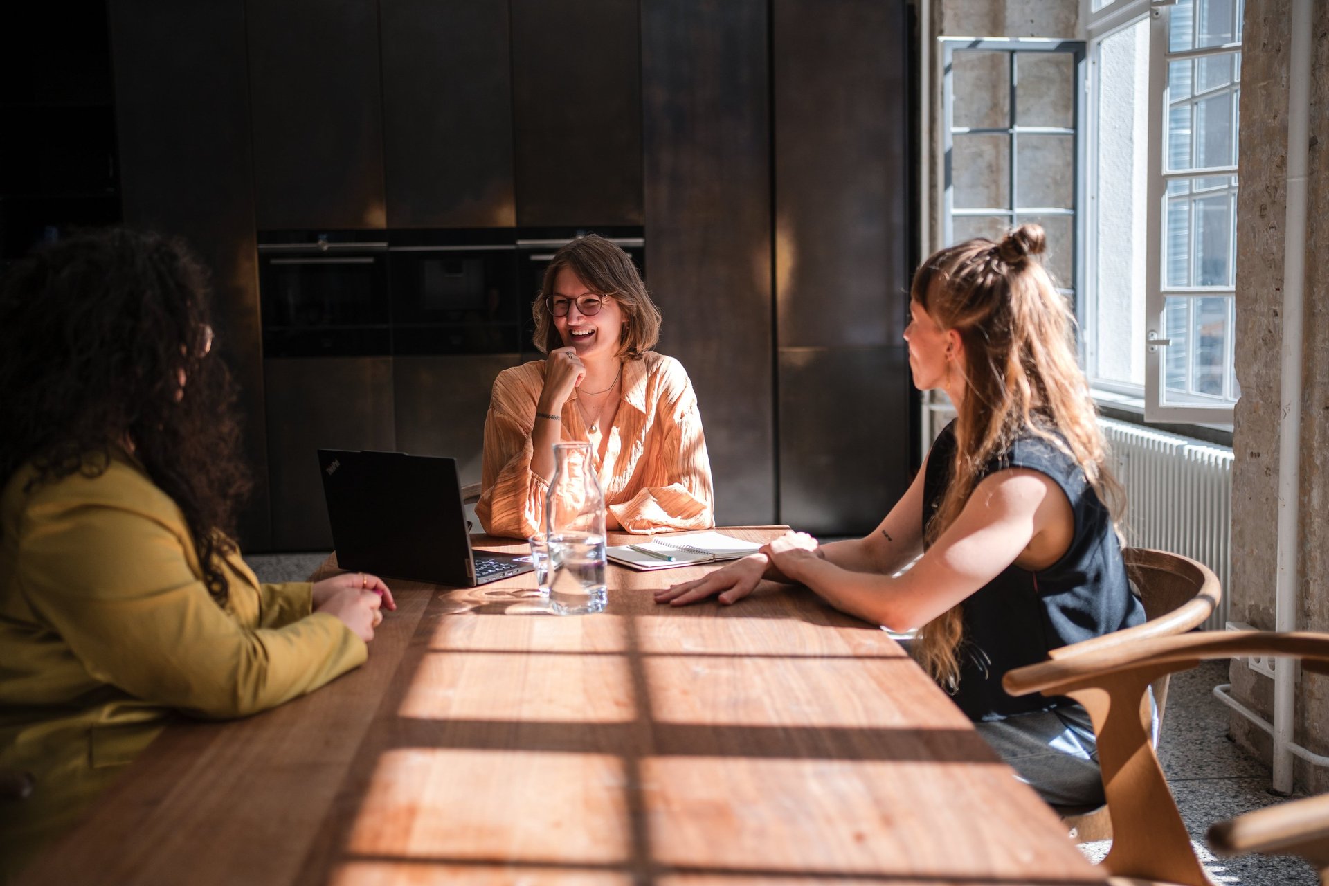 an abstract photo of a curved building with a blue sky in the background