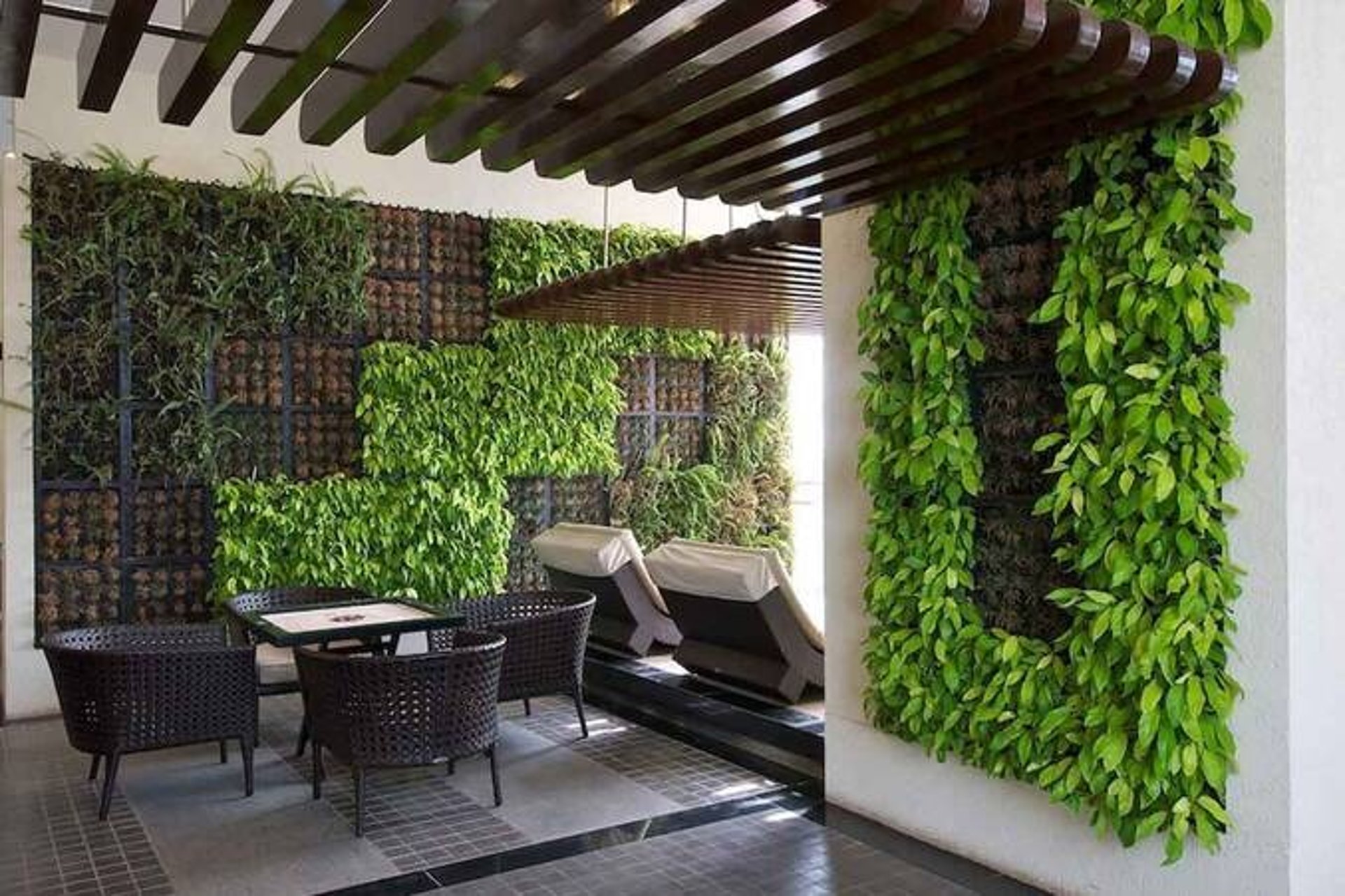 A lush, vibrant, low-maintenance vertical garden by FM Landscaping farm house