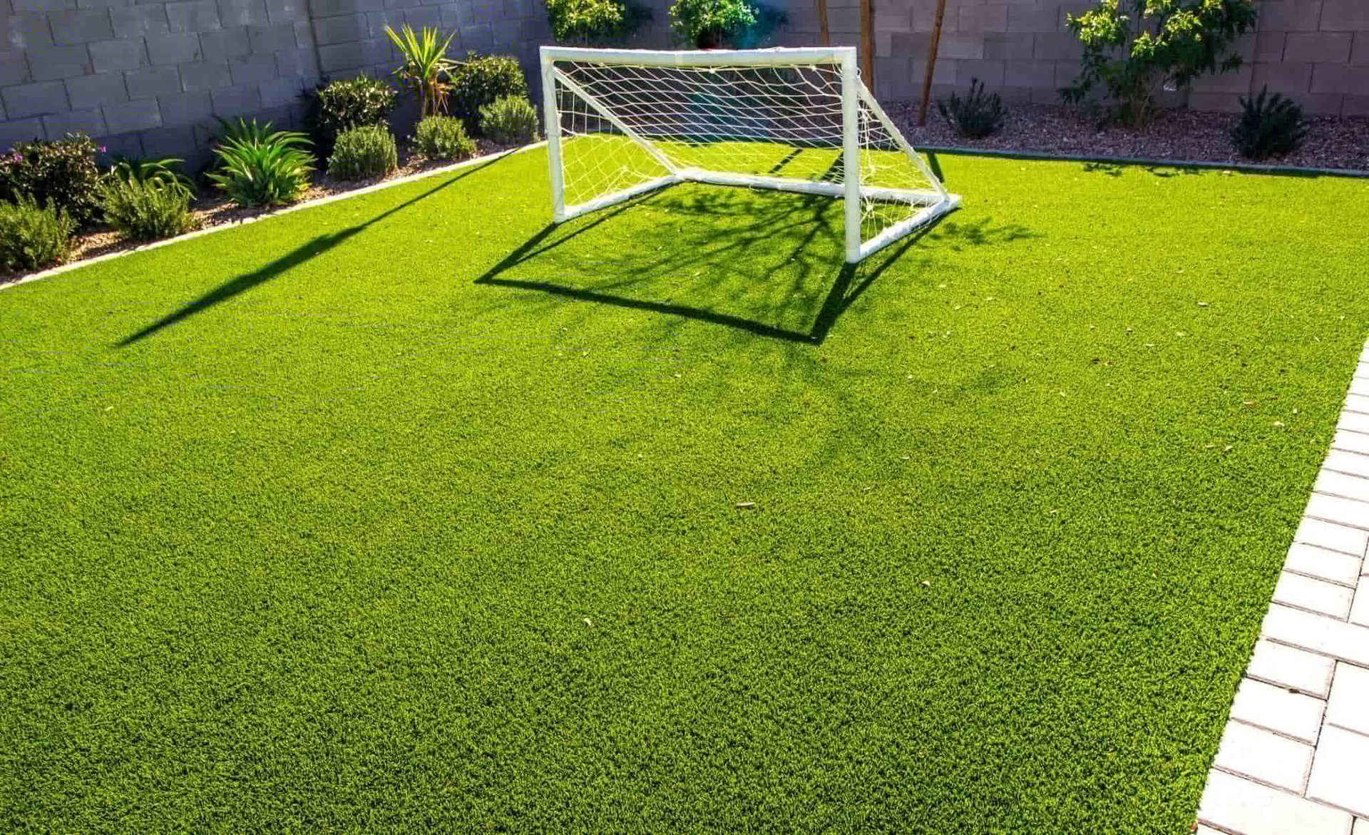 Mini Soccer Field by FM Landscaping with High-traffic Premium Bermuda Grass Lawn, perfect for durability and rapid recovery a