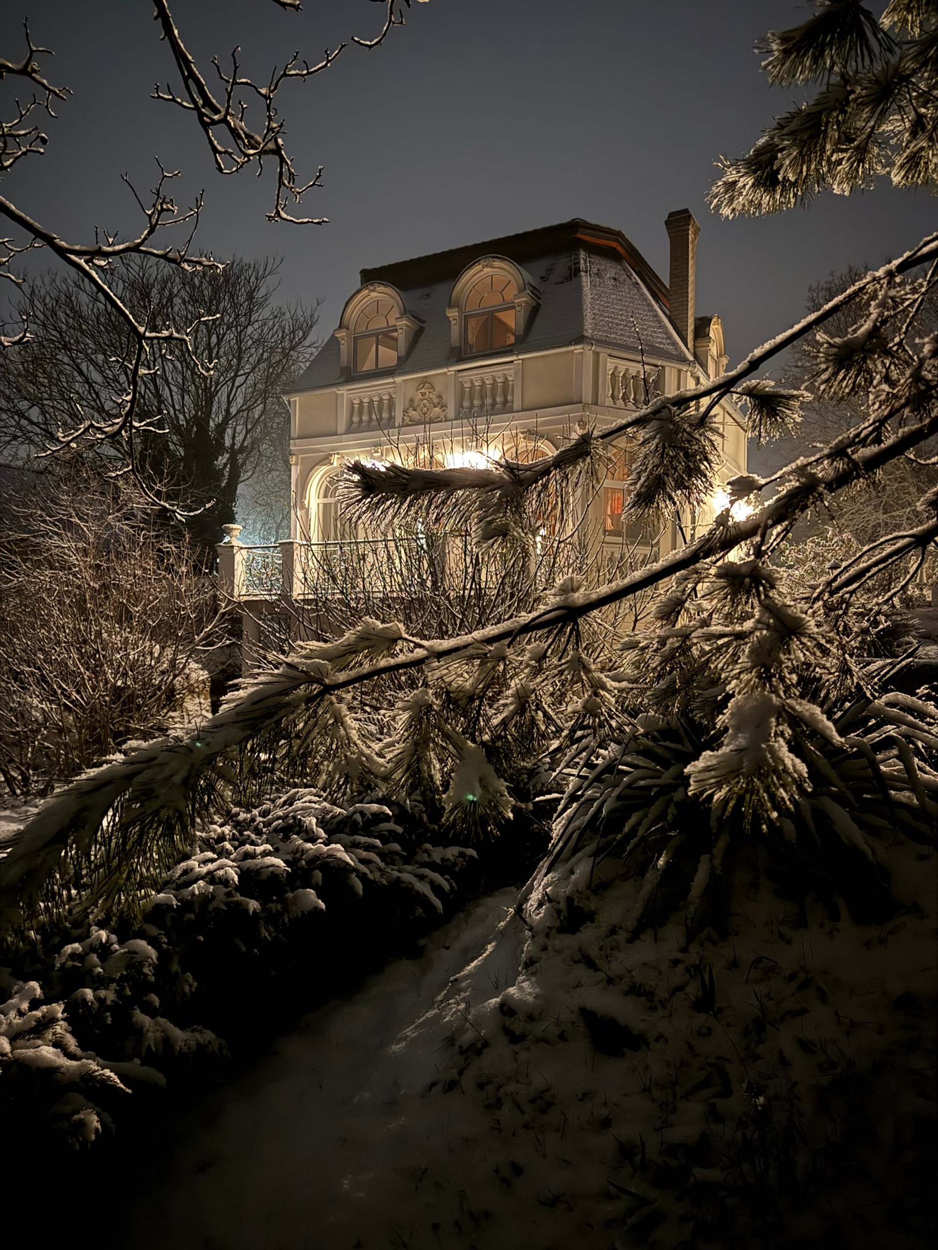 white and green concrete building near body of water during daytime