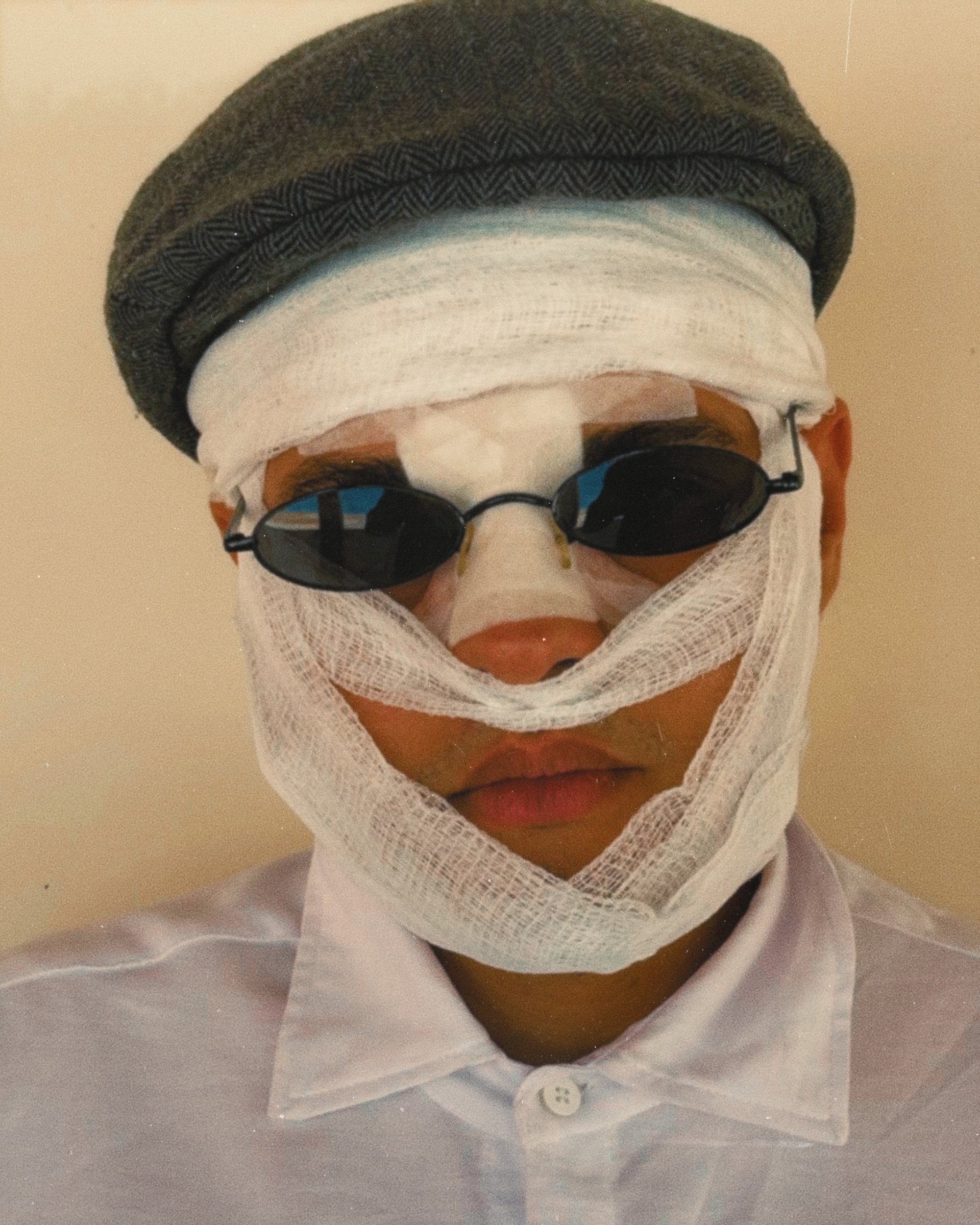 an abstract photo of a curved building with a blue sky in the background
