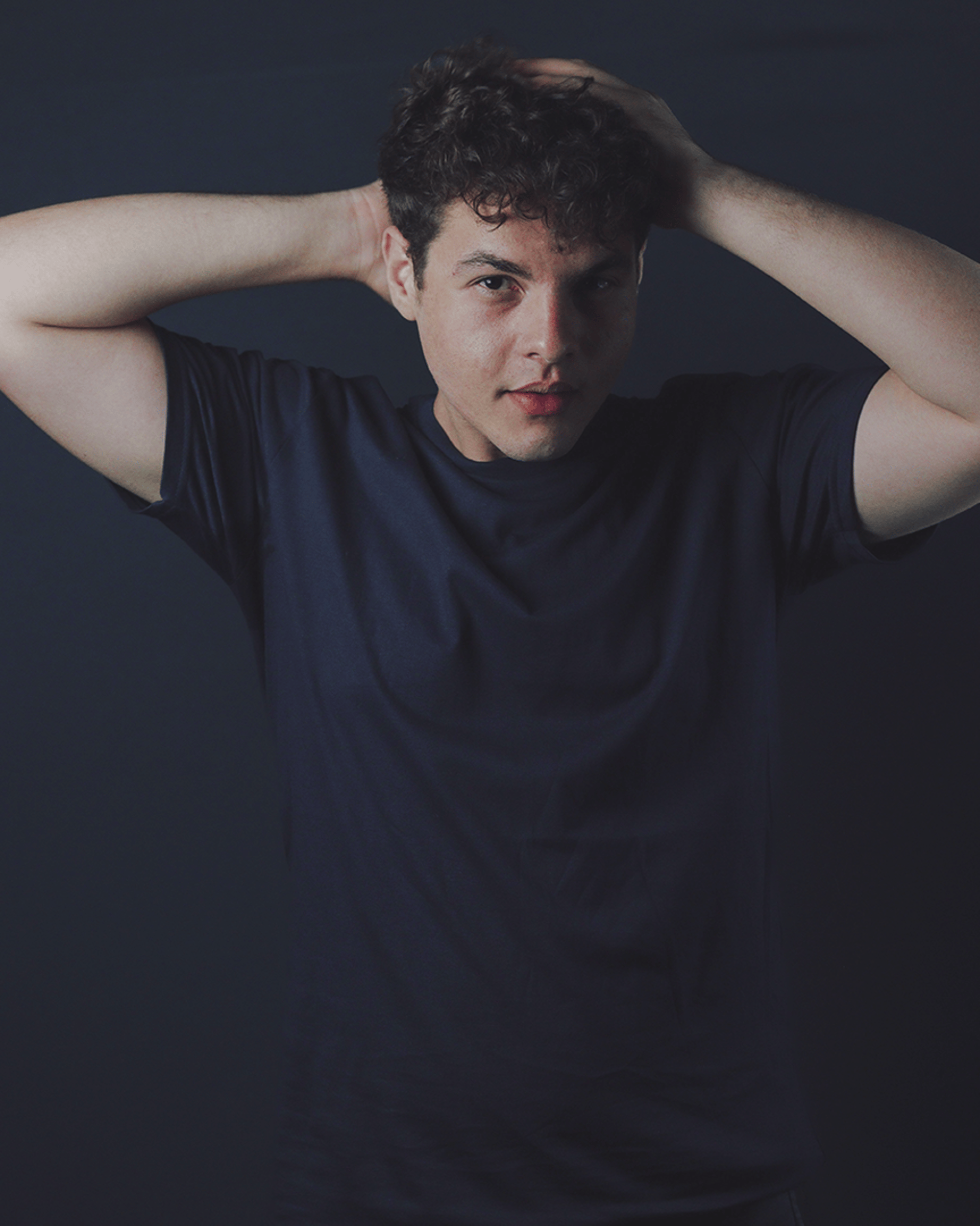 an abstract photo of a curved building with a blue sky in the background