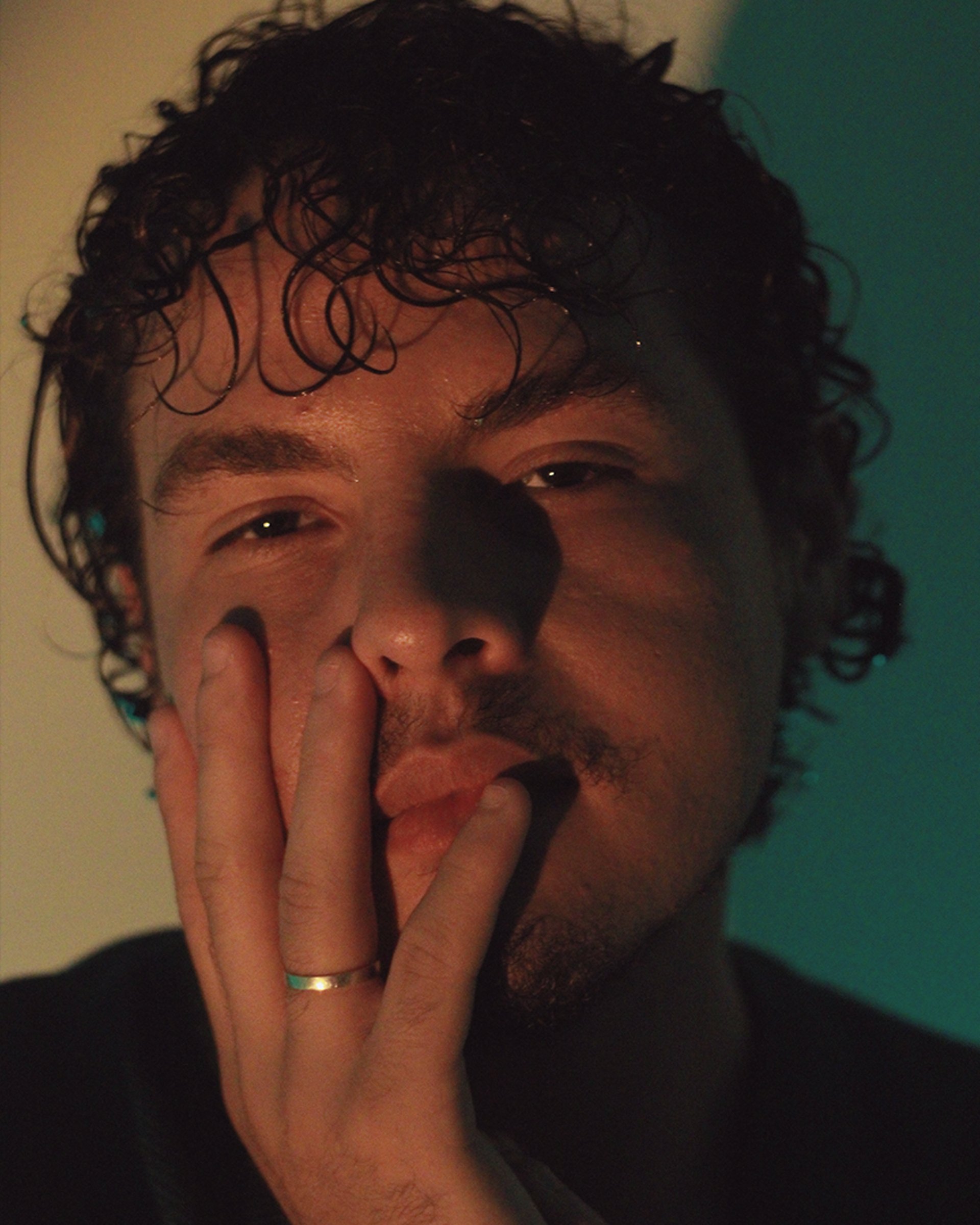 an abstract photo of a curved building with a blue sky in the background
