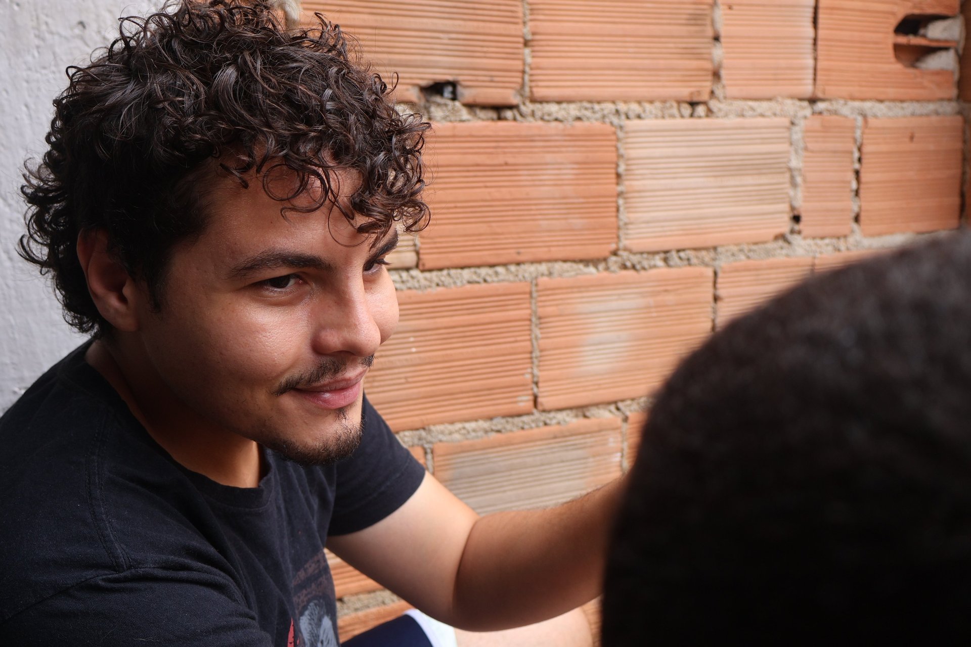 an abstract photo of a curved building with a blue sky in the background