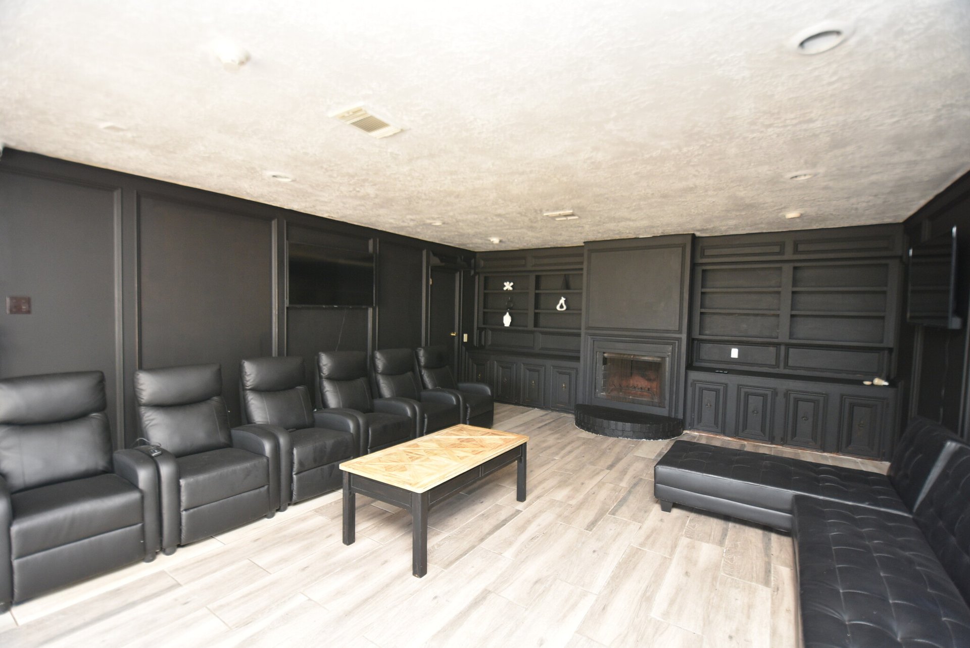 black and brown leather padded tub sofa
