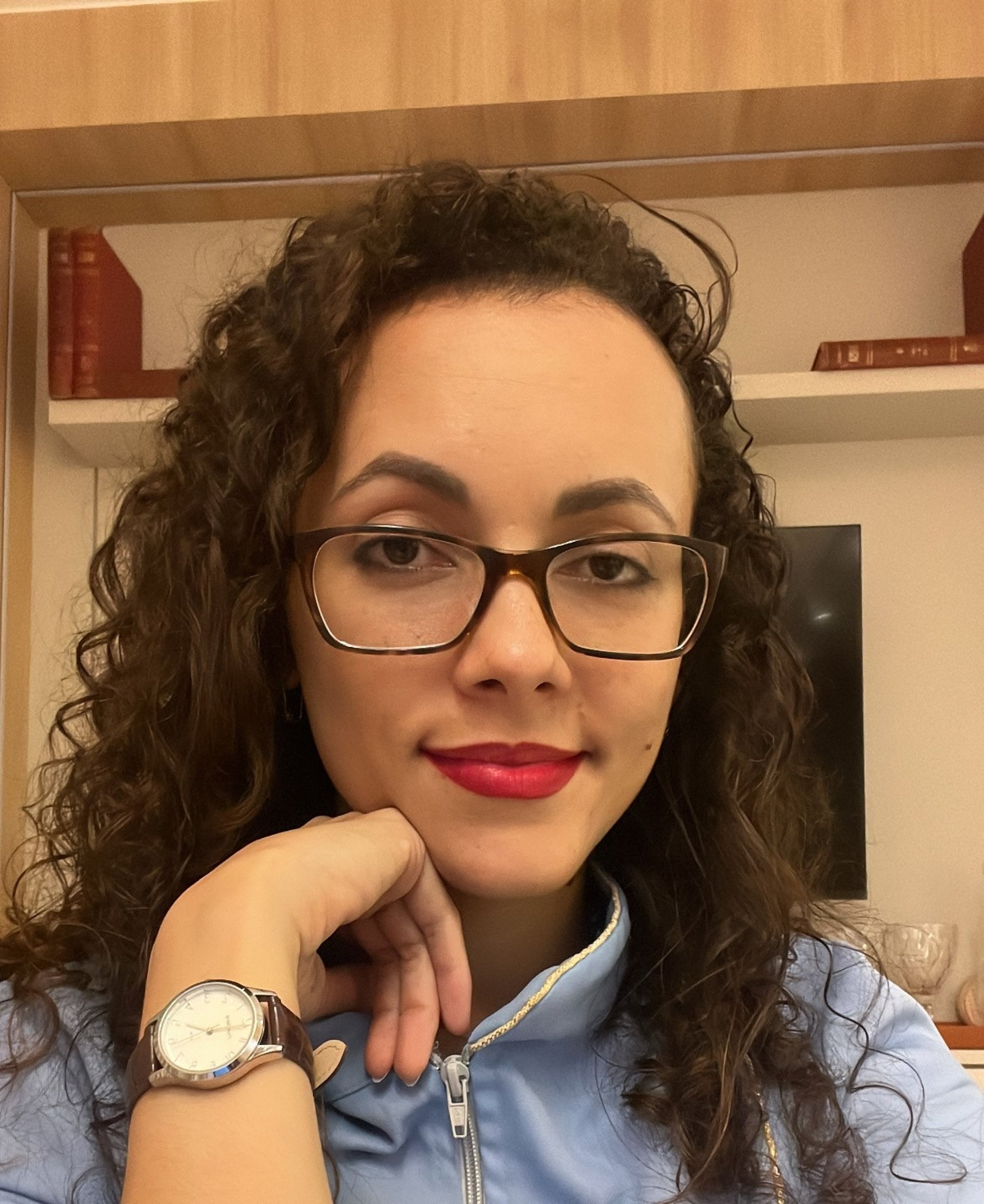 an abstract photo of a curved building with a blue sky in the background