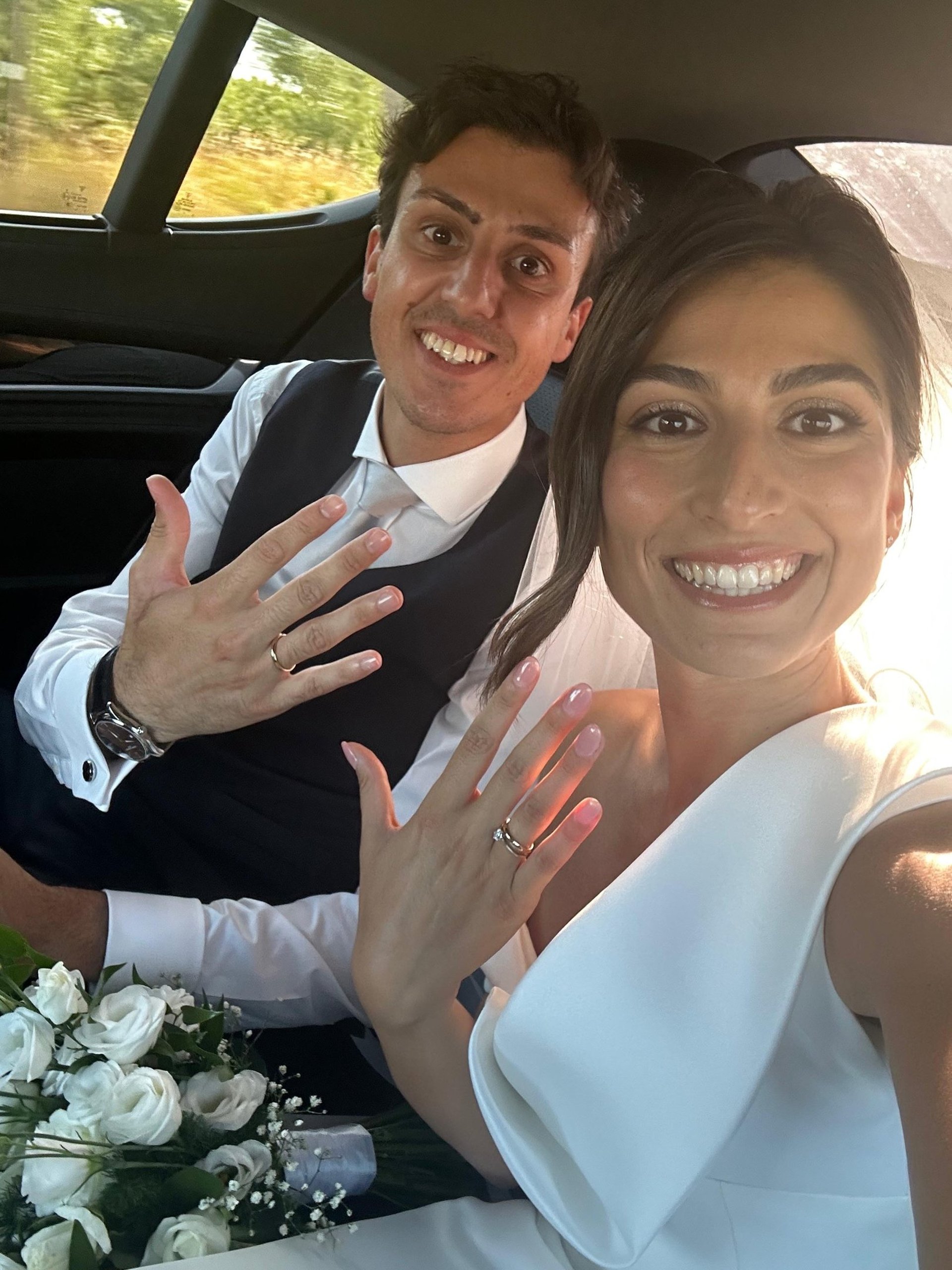 couple wearing silver-colored rings