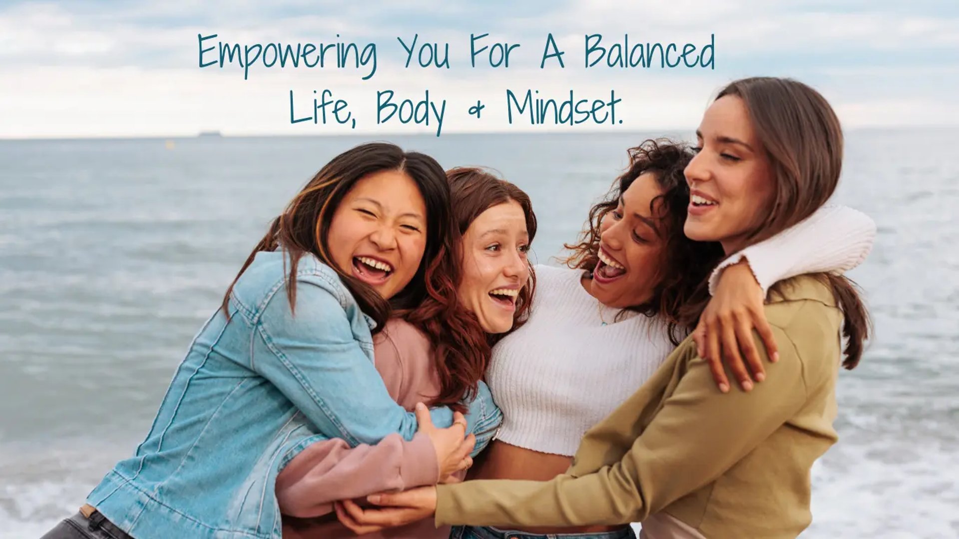 4 ladies hugging by the seaside advertising menopause help for all