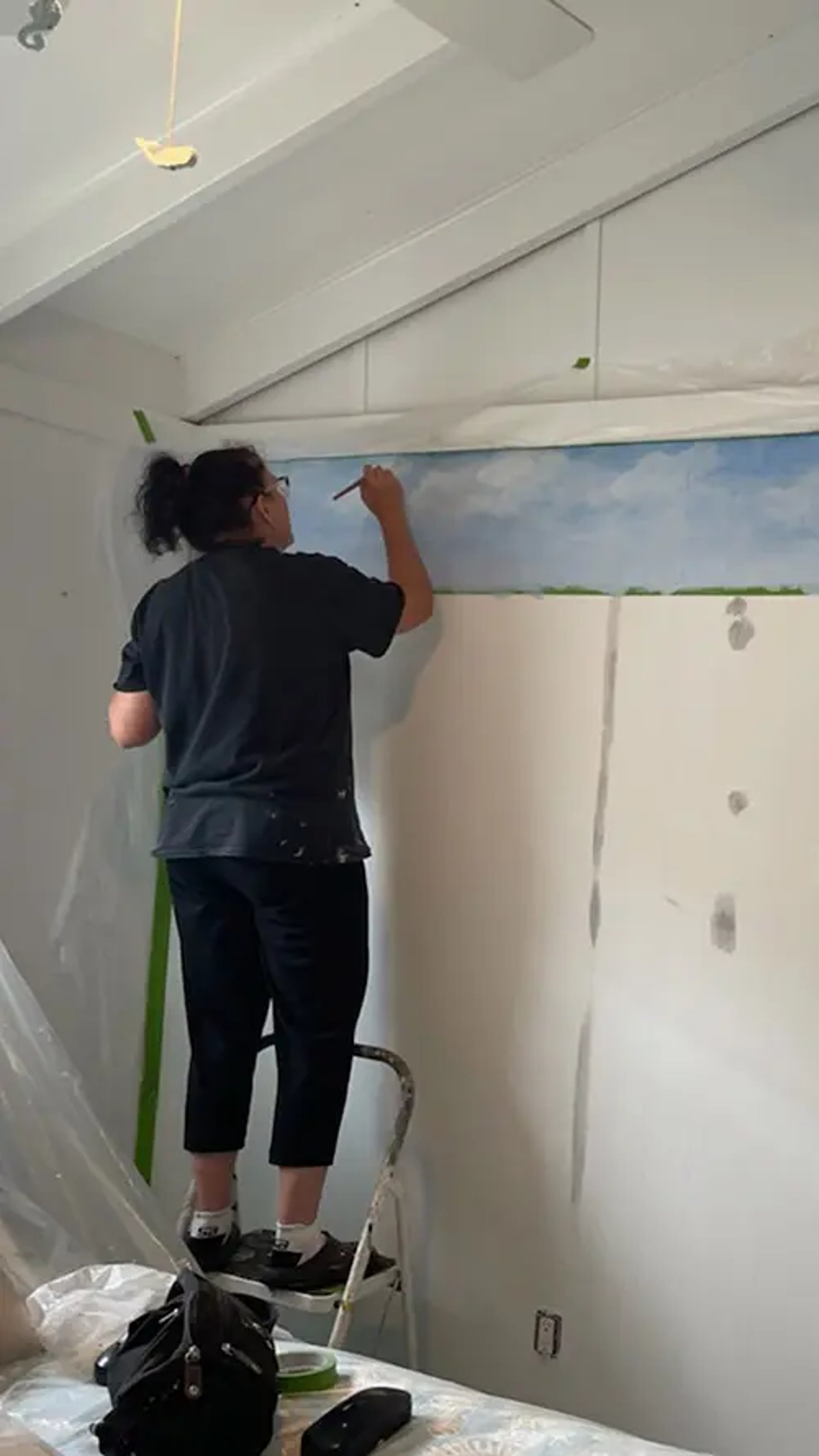 marcine painting a custom mural in lavalette nj