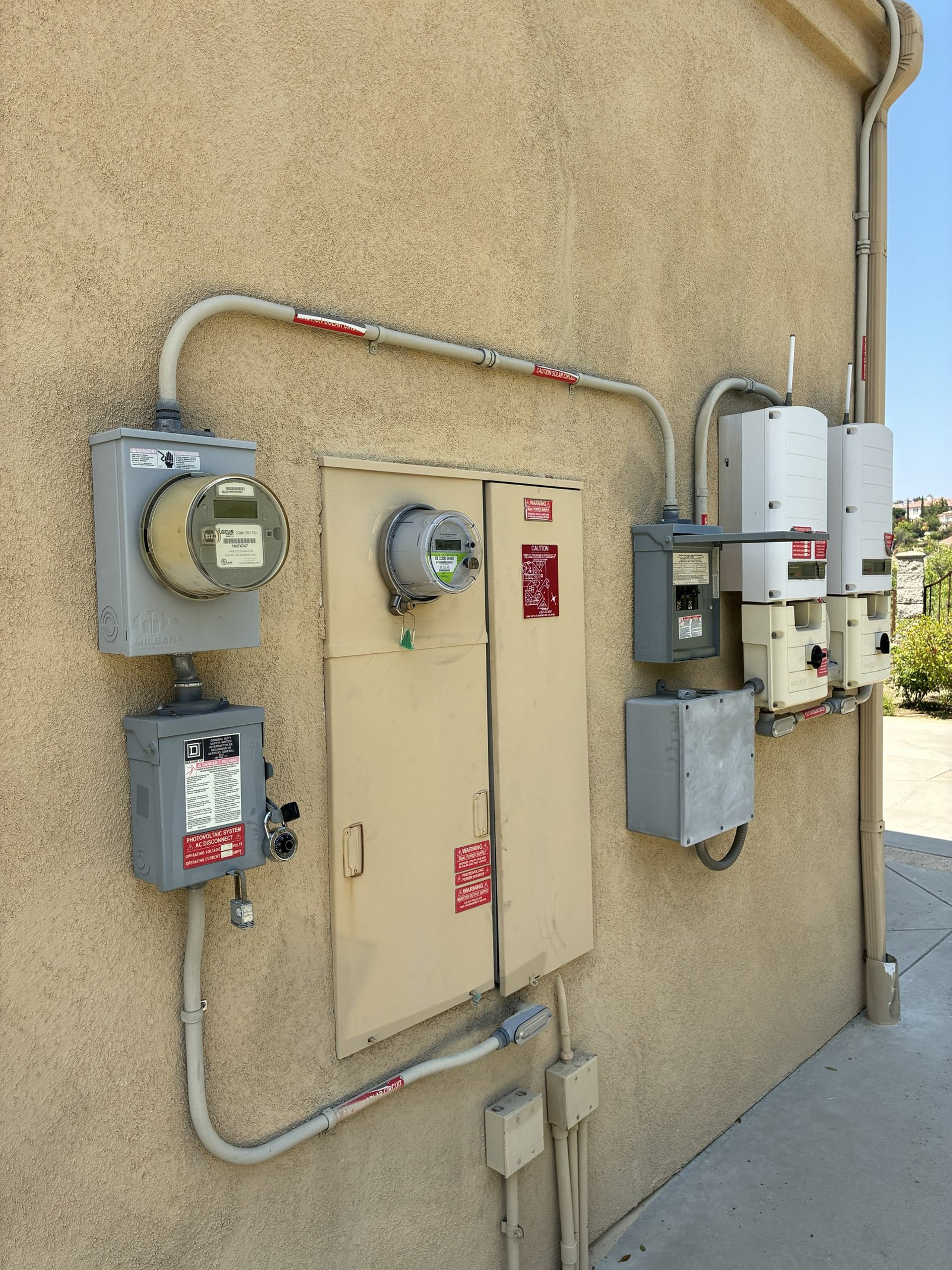 an abstract photo of a curved building with a blue sky in the background