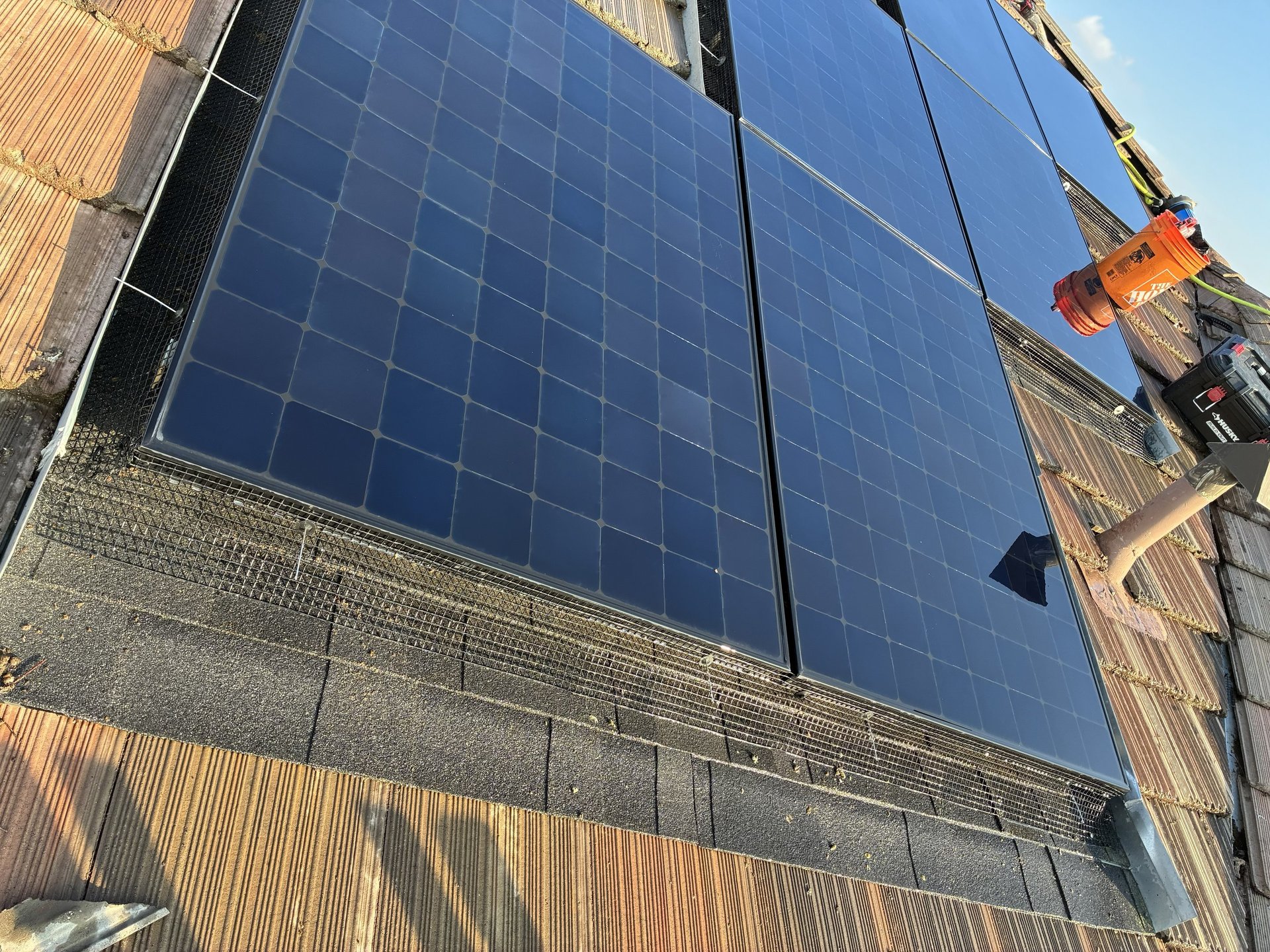 an abstract photo of a curved building with a blue sky in the background