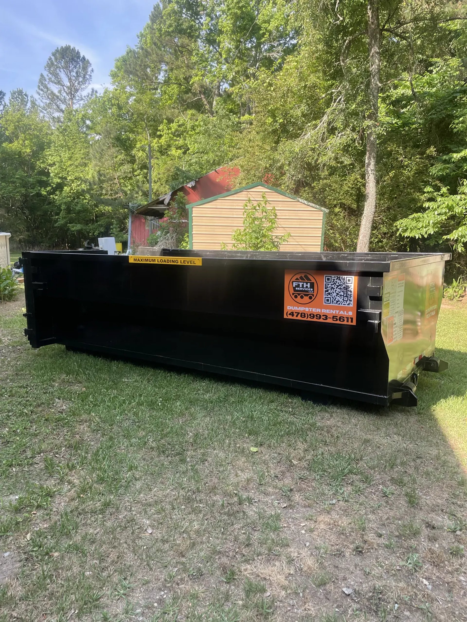 A residential dumpster provided by FTH Services and place on the customers yard. This dumpster was located in Barnesville GA.