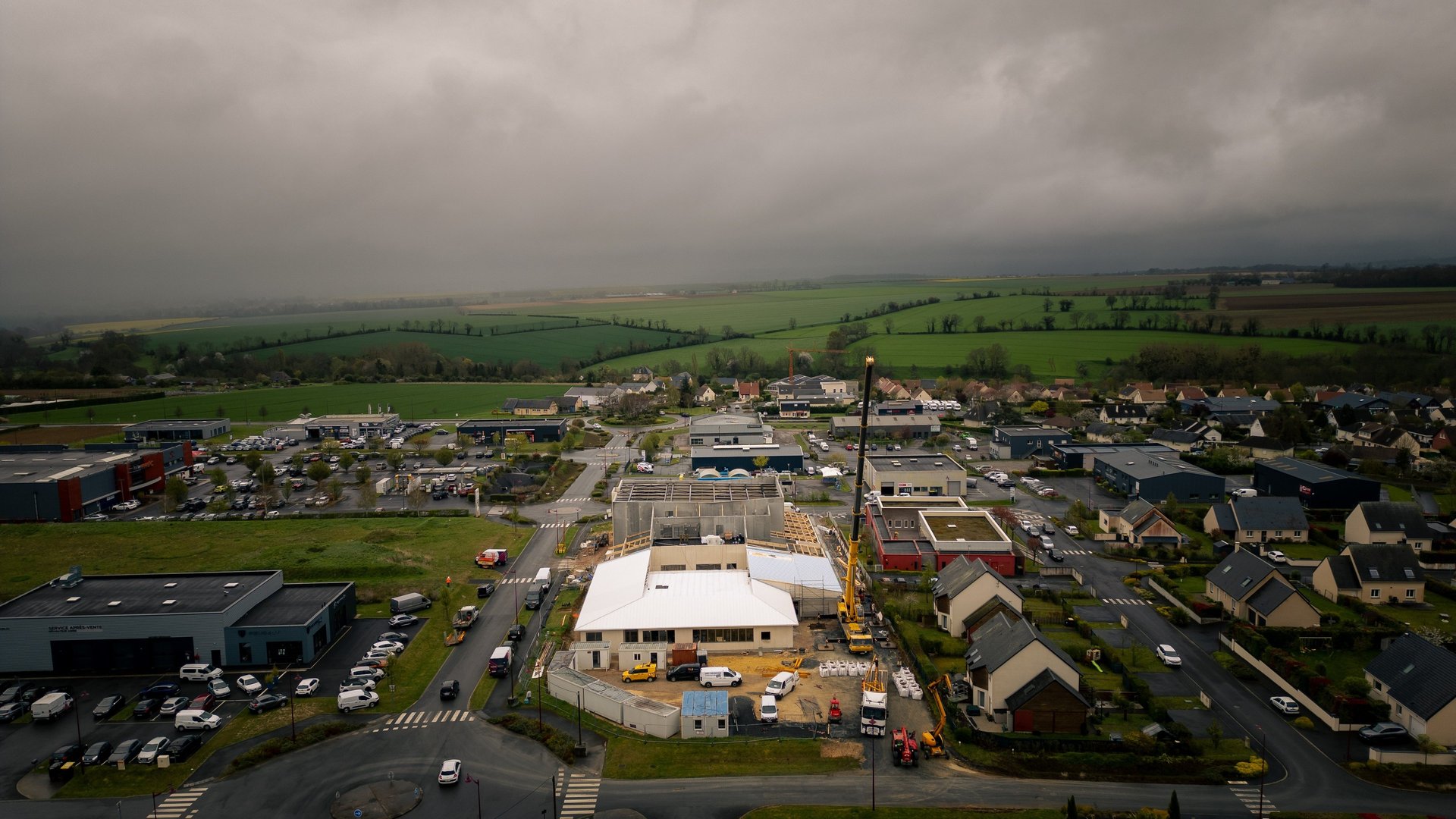 woman wearing yellow long-sleeved dress under white clouds and blue sky during daytime