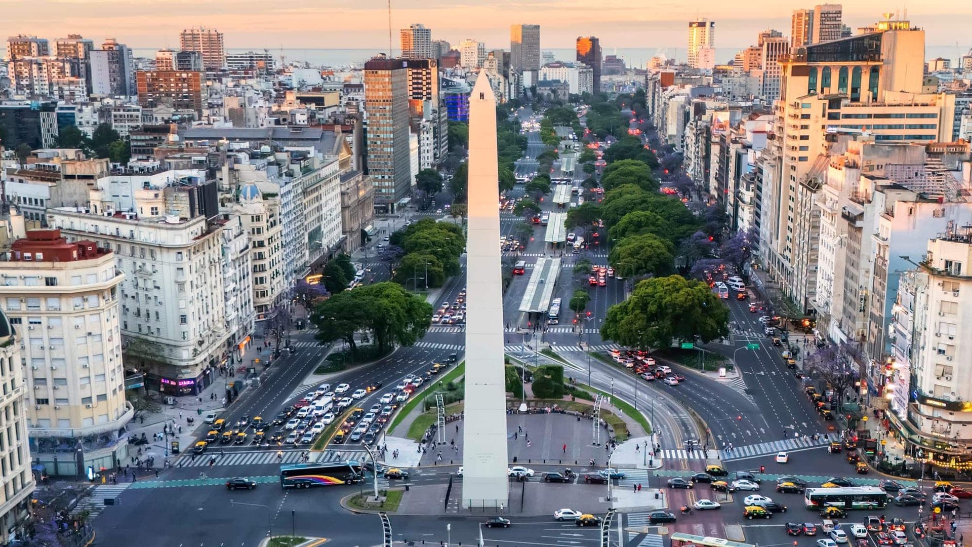 bridge over water near city buildings during daytime